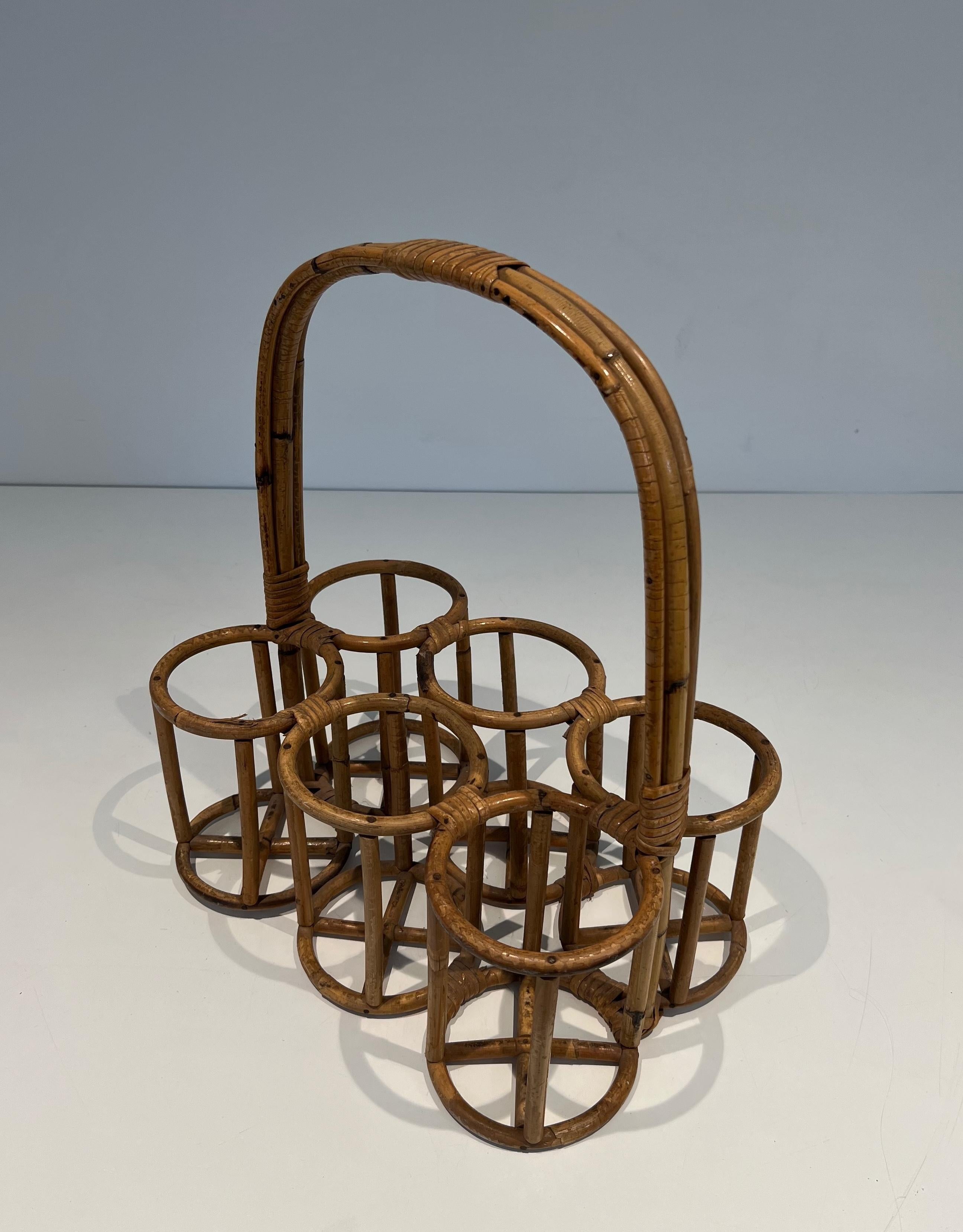 This nice and rare bottles holder is made of rattan.This is a French work. Circa 1950