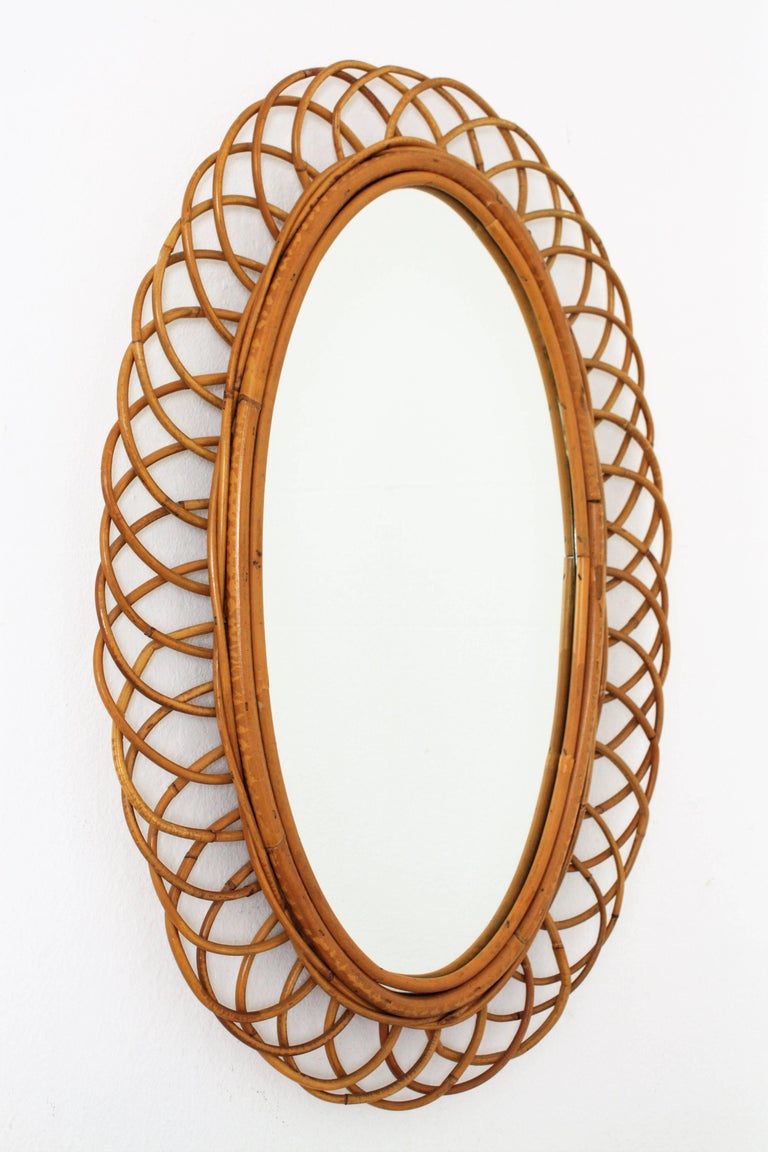 Rattan Cane and Bamboo Flower Burst Oval Mirror, Spain, 1960s For Sale