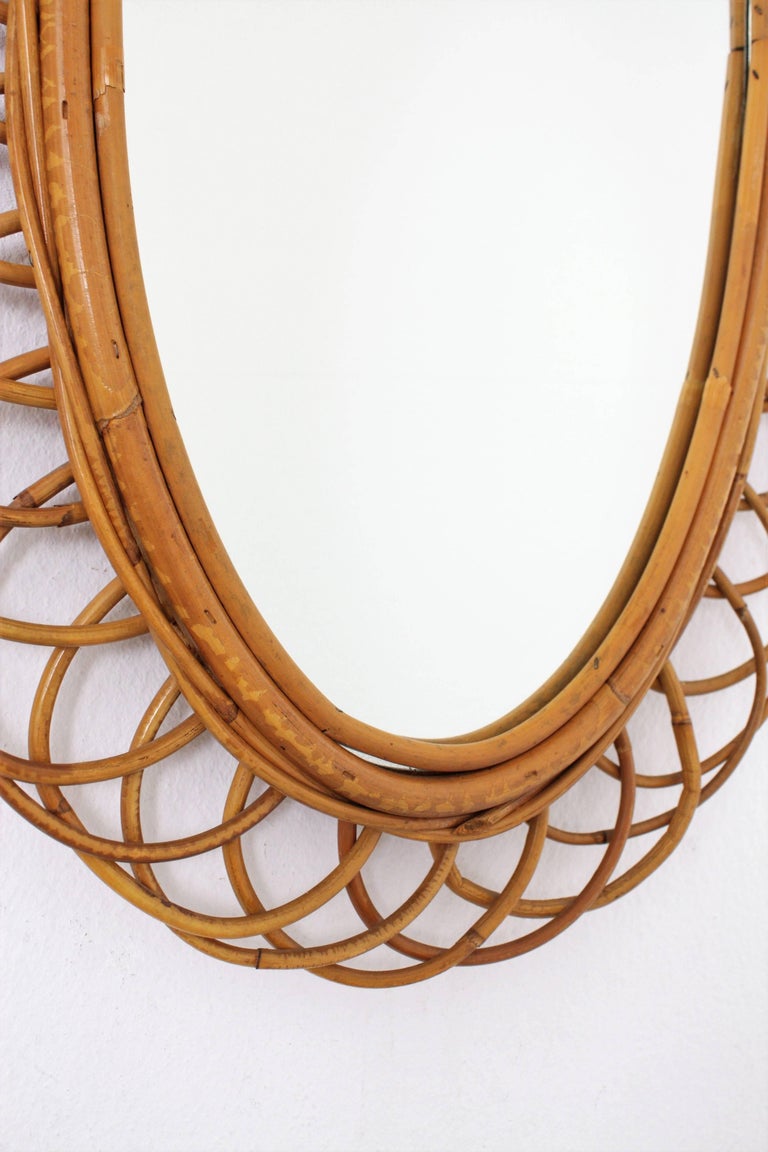 Rattan Cane and Bamboo Flower Burst Oval Mirror, Spain, 1960s For Sale
