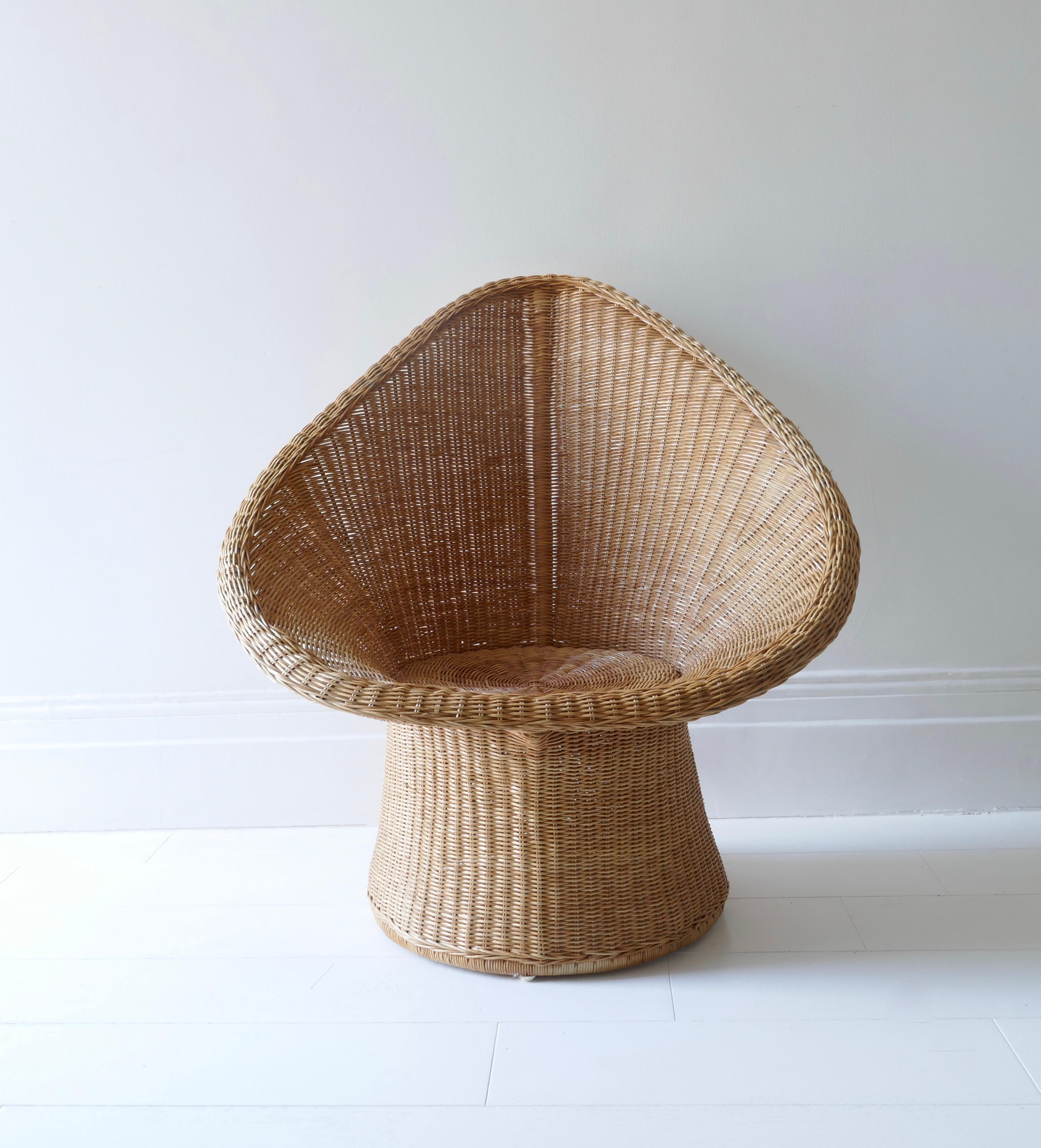 Rattan cane wicker tulip lounge chair, 1970s
A curvaceous silhouette for this environmentally statement armchair. Perfectly blending country chic and modern minimalism, the design effortlessly adds a touch of elegance to any indoor or outdoor