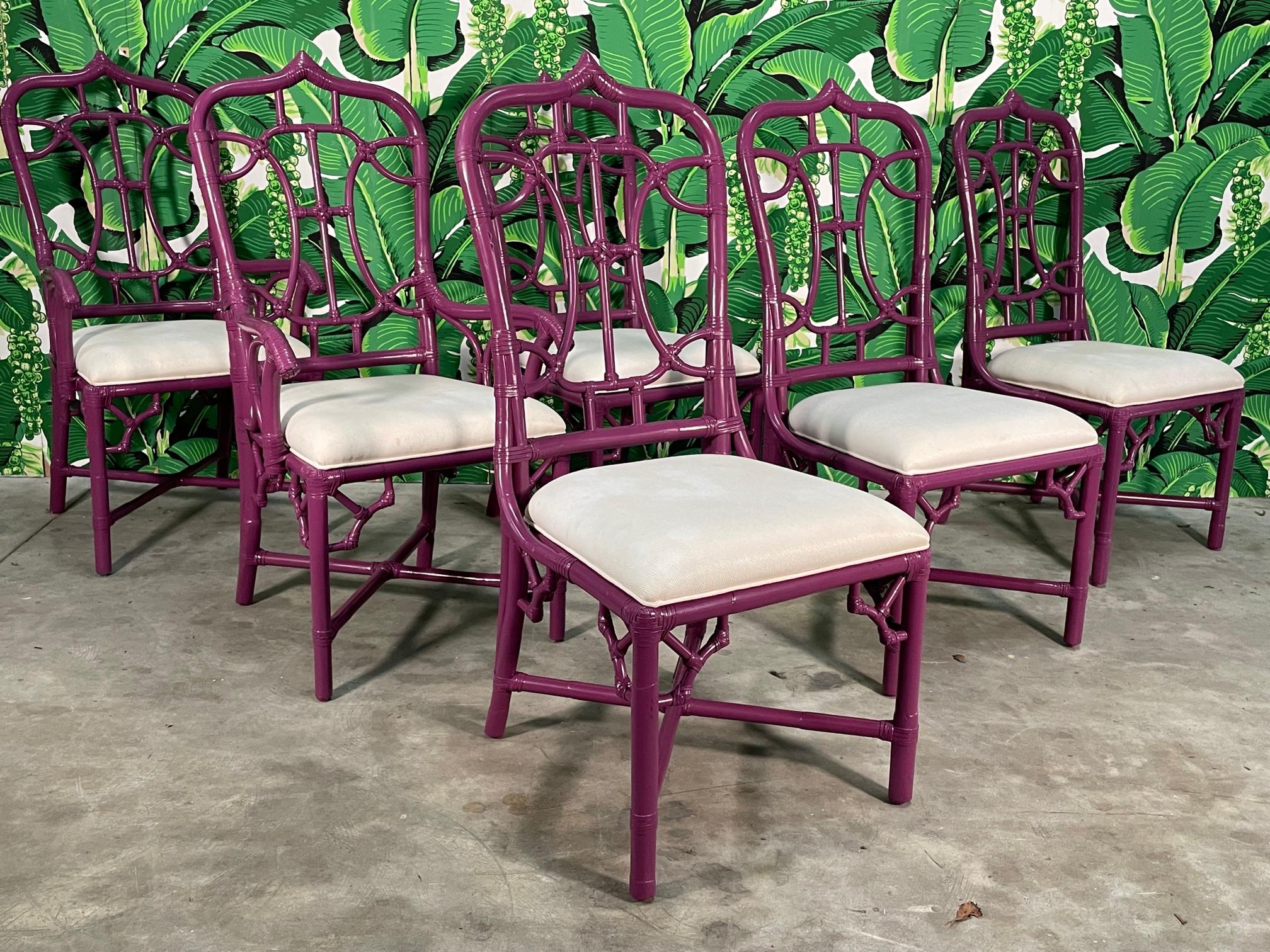 Set of 6 rattan cathedral dining chairs in the style of McGuire feature an organic curved fretwork and a newly lacquered gloss finish. Rattan spandrels, X stretchers, and leather lashings confirm the excellent craftsmanship of this set. Good