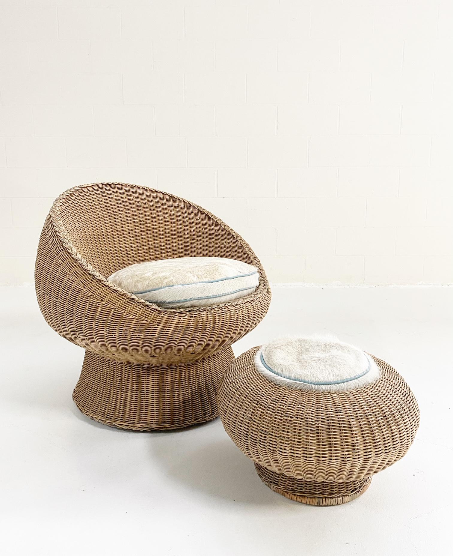 In the style of Eero Aarnio. 

The romance of rattan! Homey, versatile, and always stylish. This chair and ottoman set is part of a 10-piece set but we have decided to sell the pieces separately. You can view the whole set at this link.

For the
