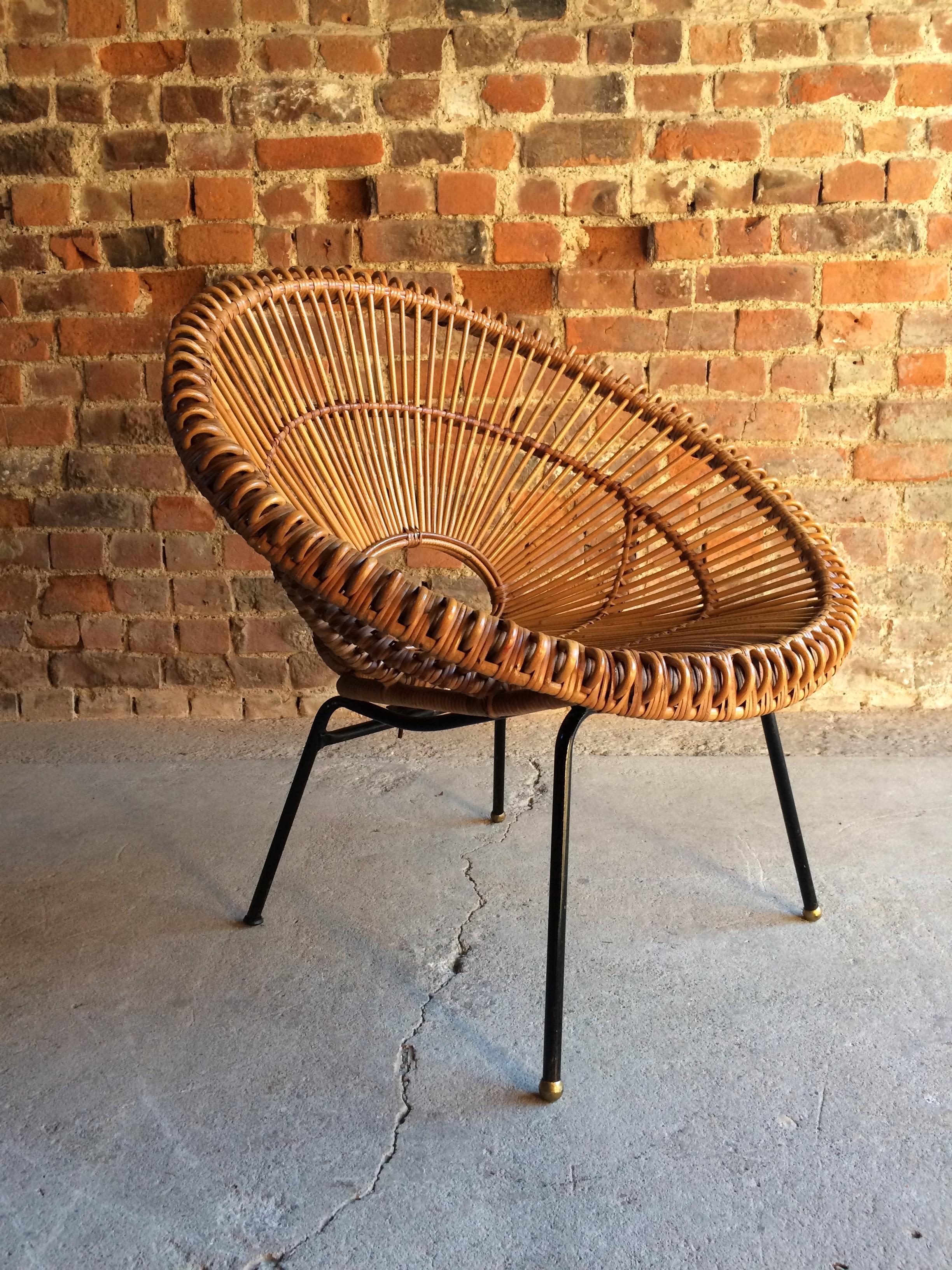 Stunning midcentury Franco Albini sunburst rattan chair circa 1950's

Description:

Stunningly beautiful mid century 'Sunburst' rattan chair attributed to Franco Albini or sometimes Janine Abraham circa 1950s, fabulous deep bucket seat with open