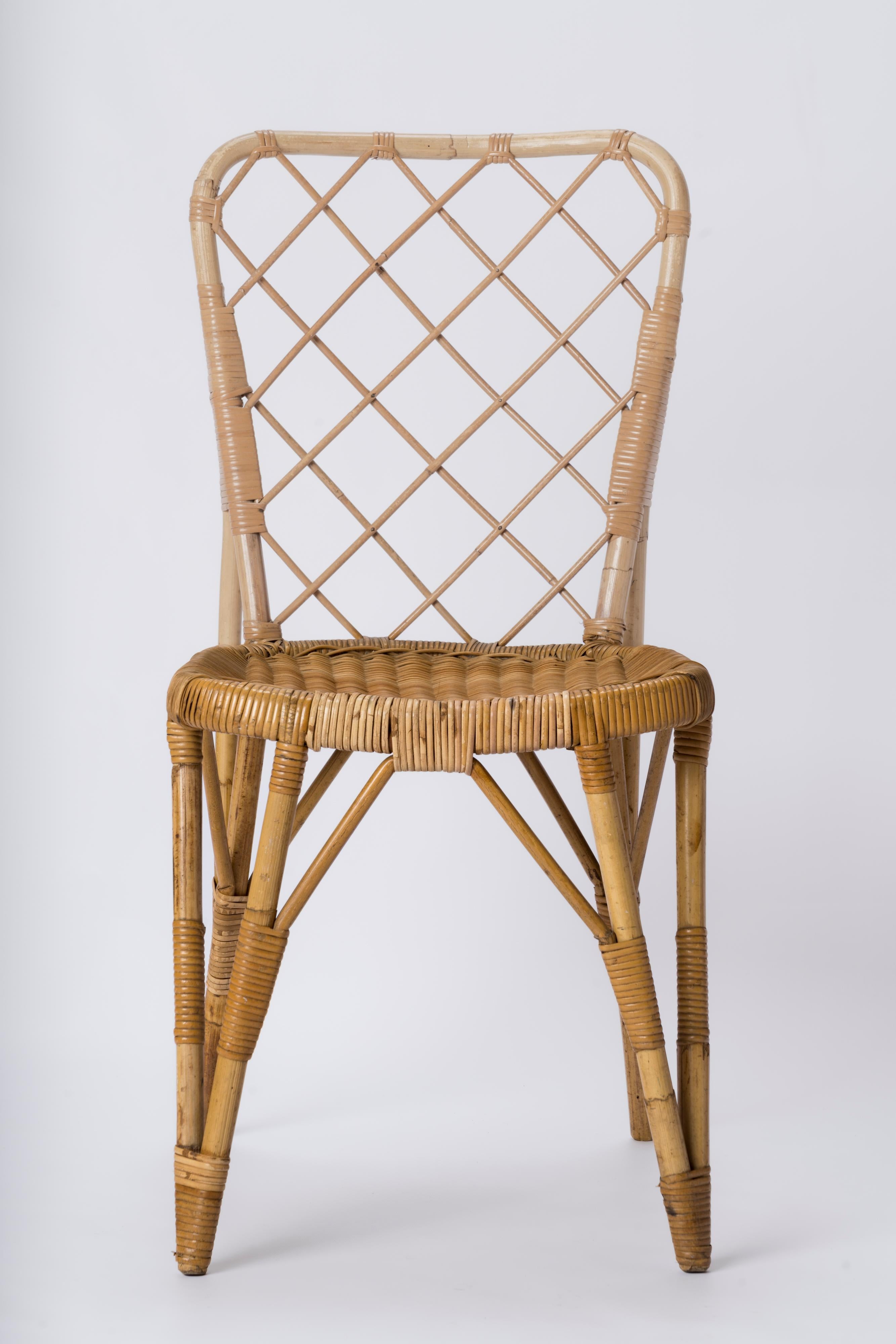 French Rattan Chair with Braided Back in the style of Louis Sognot - France 1960's For Sale