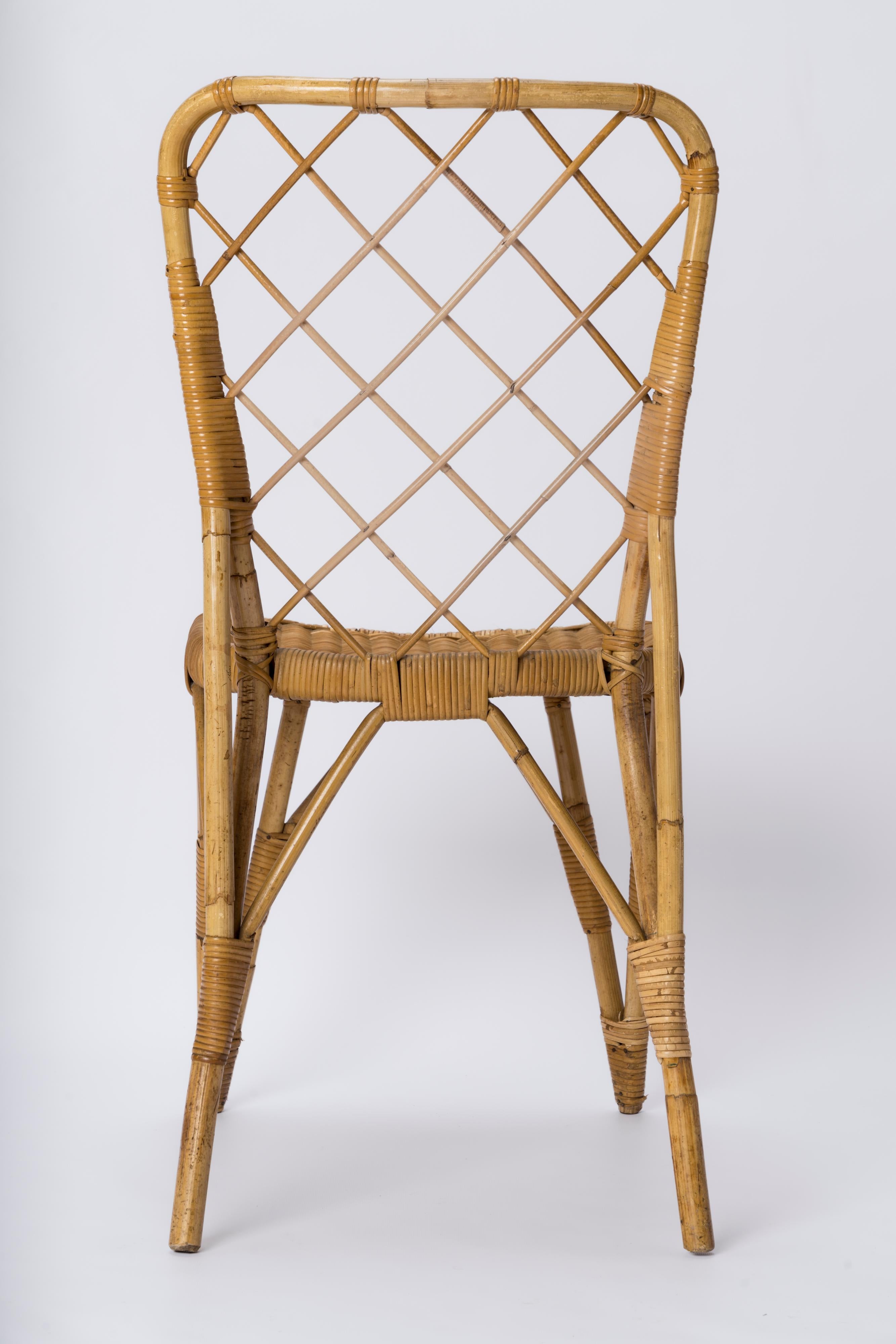 Wicker Rattan Chair with Braided Back in the style of Louis Sognot - France 1960's For Sale