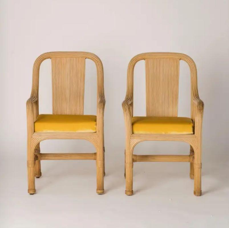 Graphic pair of rattan chairs attributed to Vivai del Sud. In good vintage condition. Newly upholstered seat cushions in golden velvet. 