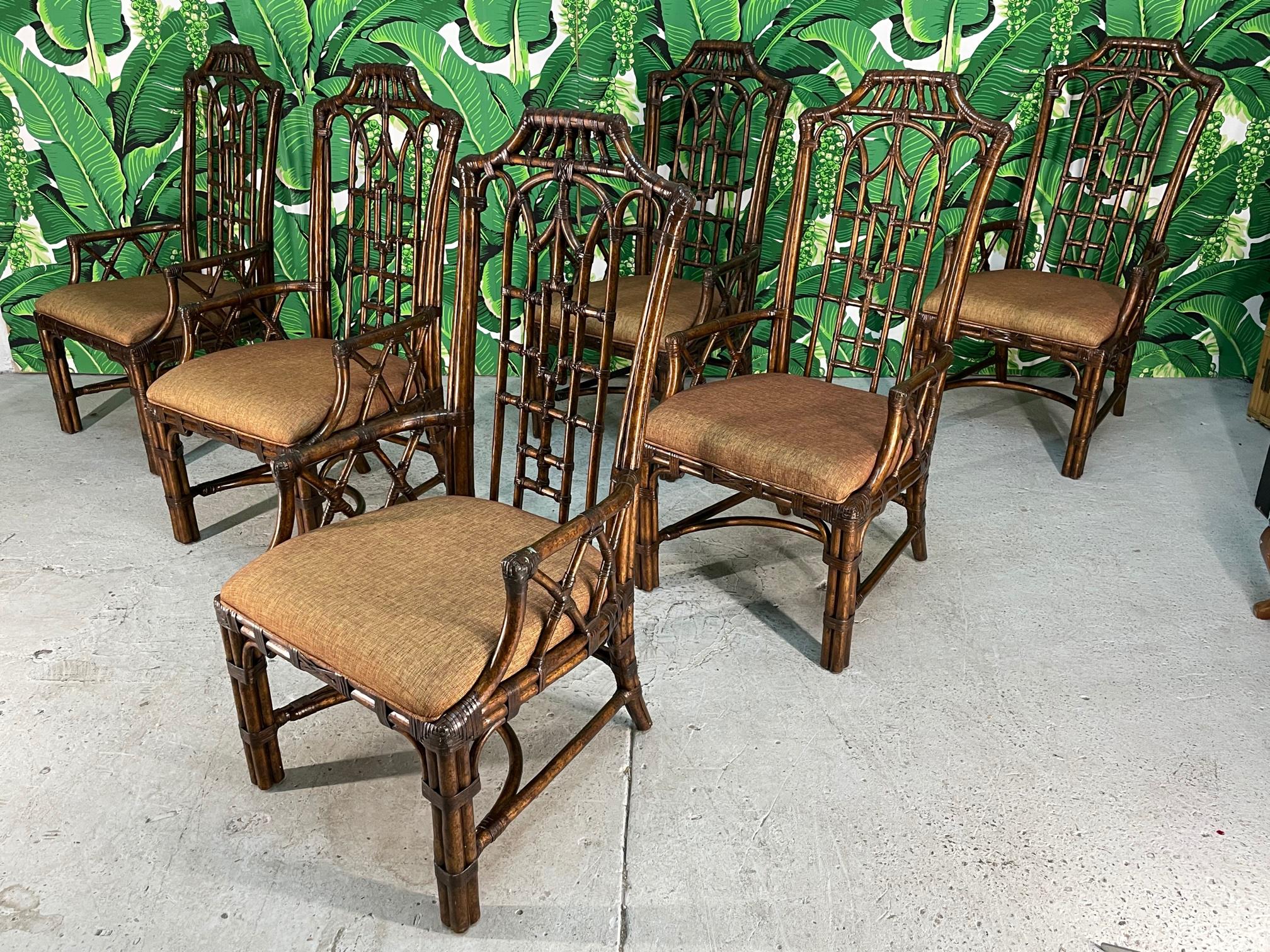 Set of six Asian dining chairs feature full rattan frame and intricate pagoda style fretwork. Good condition with minor imperfections consistent with age.

Background courtesy of Dorothy Draper 