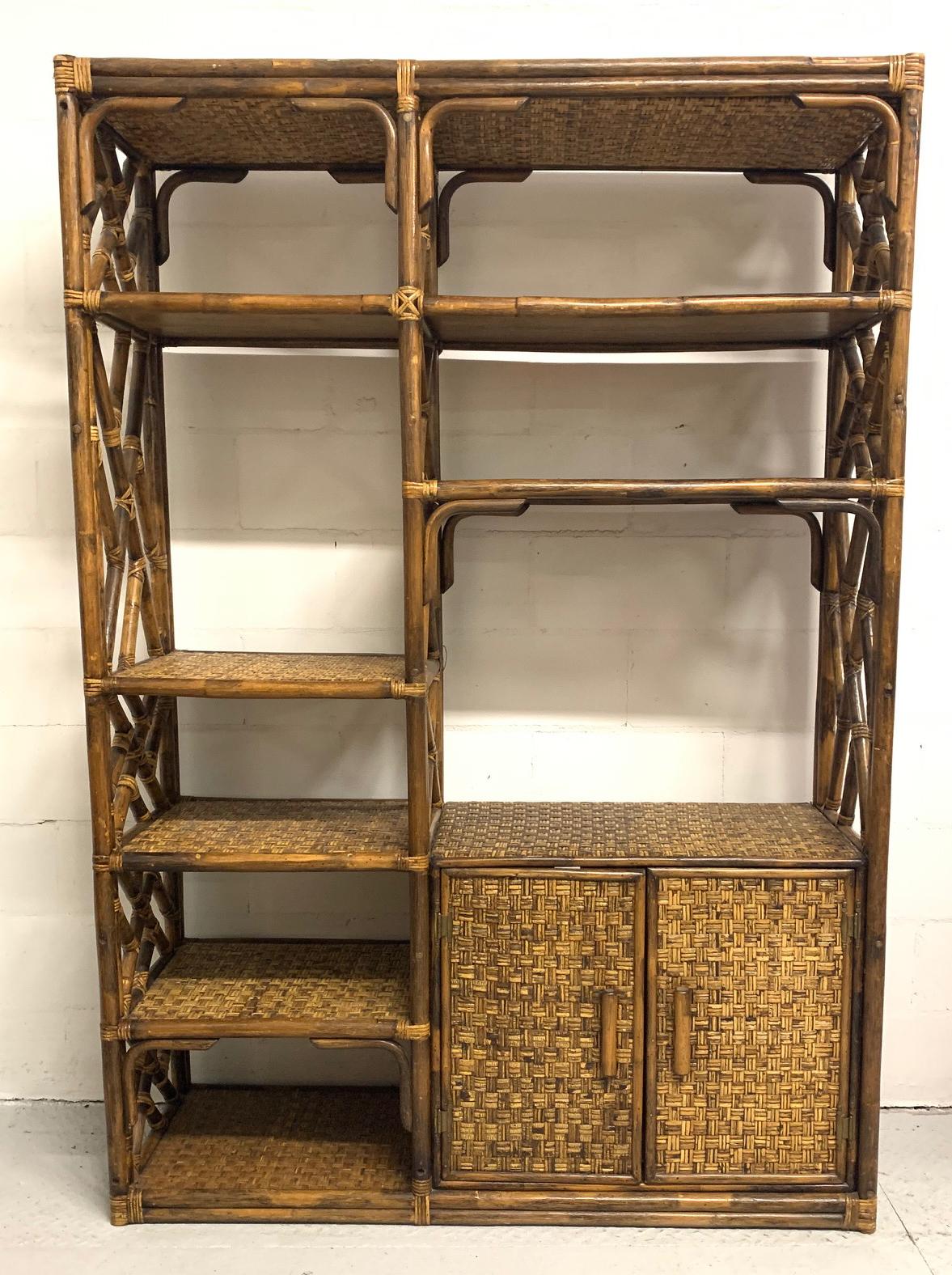 Rattan étagère in the Chinese Chippendale style features a rich, dark finish and woven rattan shelving. Double doors reveal more storage. Very heavy and sound, this piece shows construction of the highest standard. Very good vintage condition with