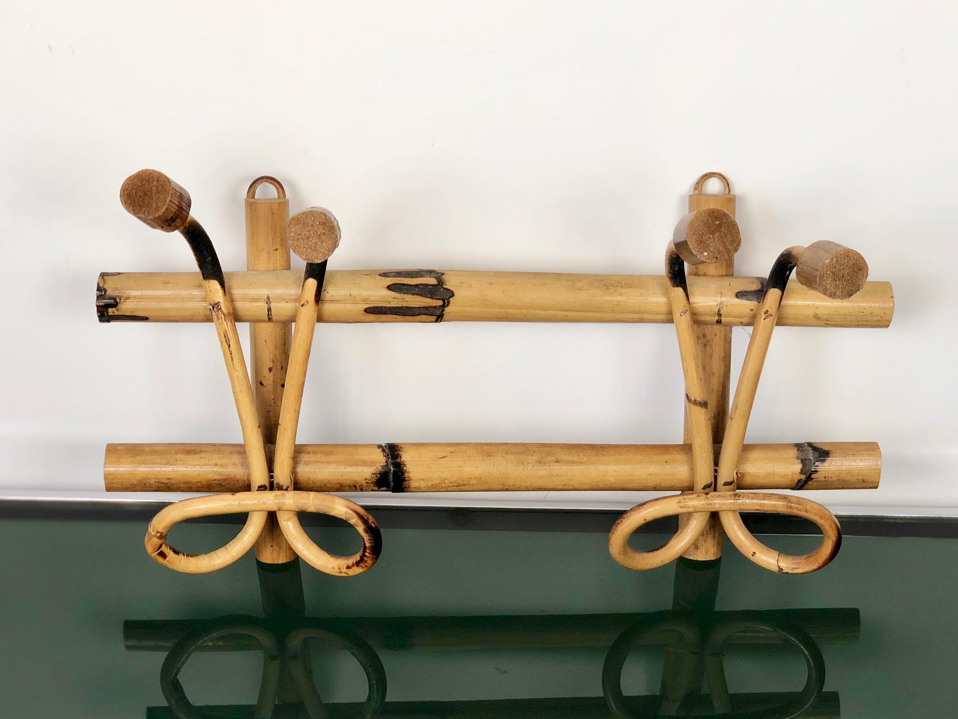 Rattan coat hanger featuring two hooks, Italy, circa 1960.