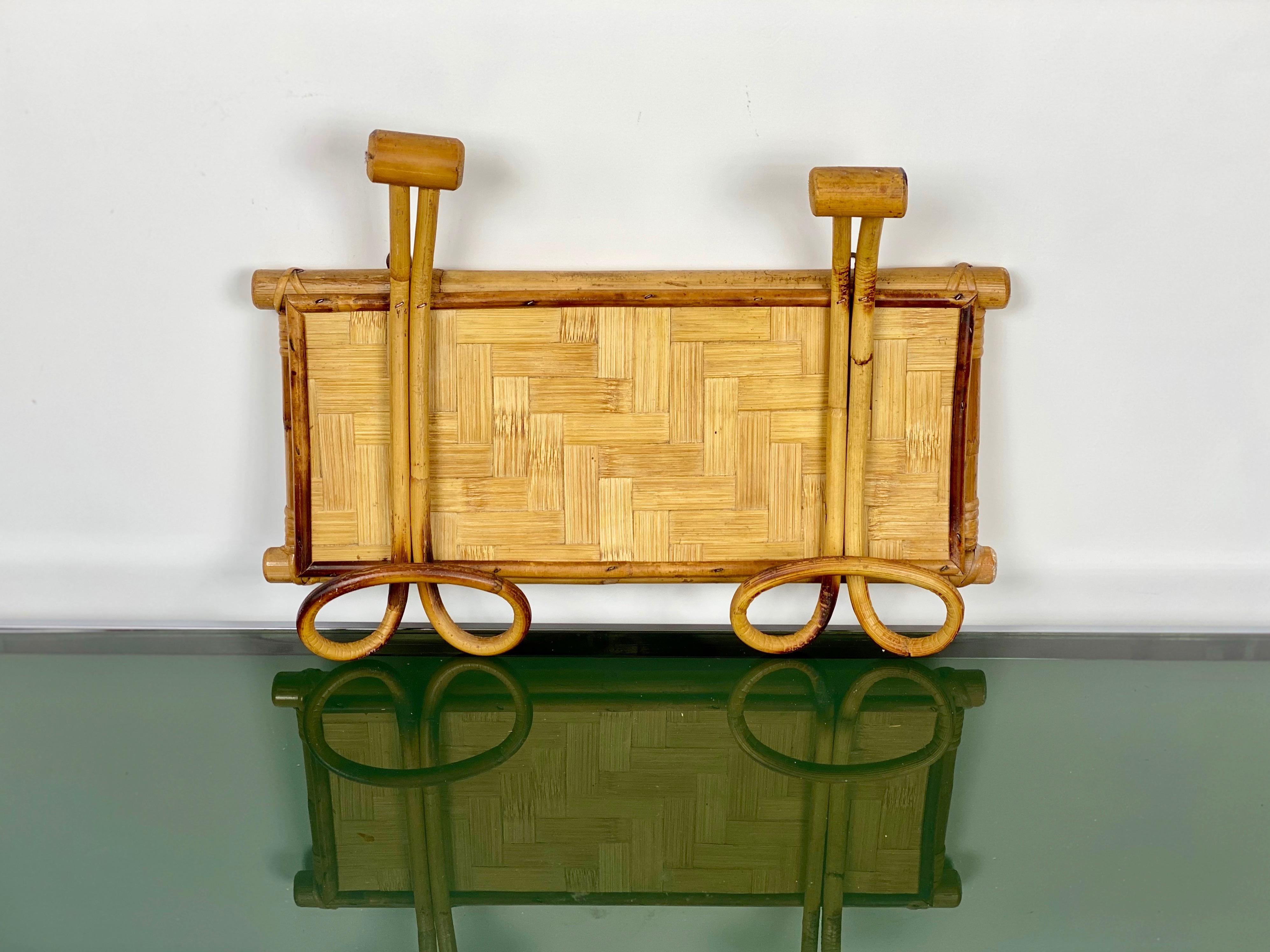 Rattan coat hanger featuring two hooks, Italy, circa 1960.