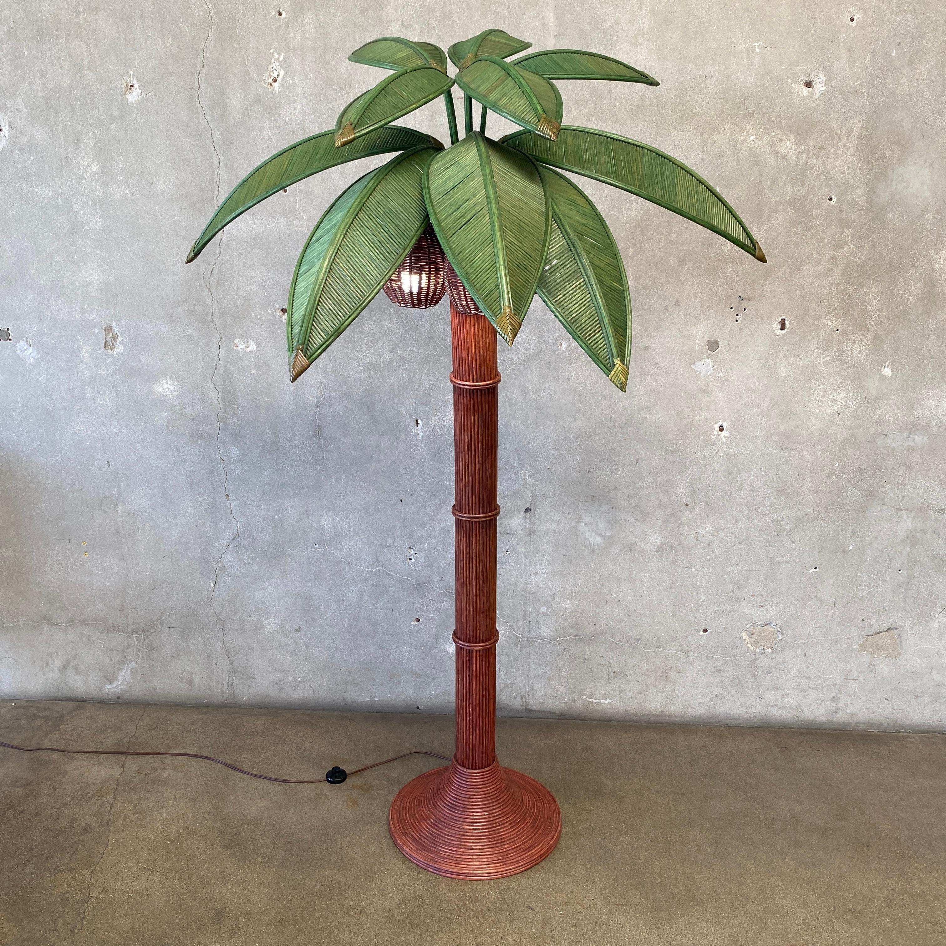 Presenting a vintage rattan coconut palm tree floor lamp, perfect for adding a touch of coastal style to your decor. This exquisite piece features three coconut lights nestled beneath nine arrangeable palm leaves, creating a charming and functional