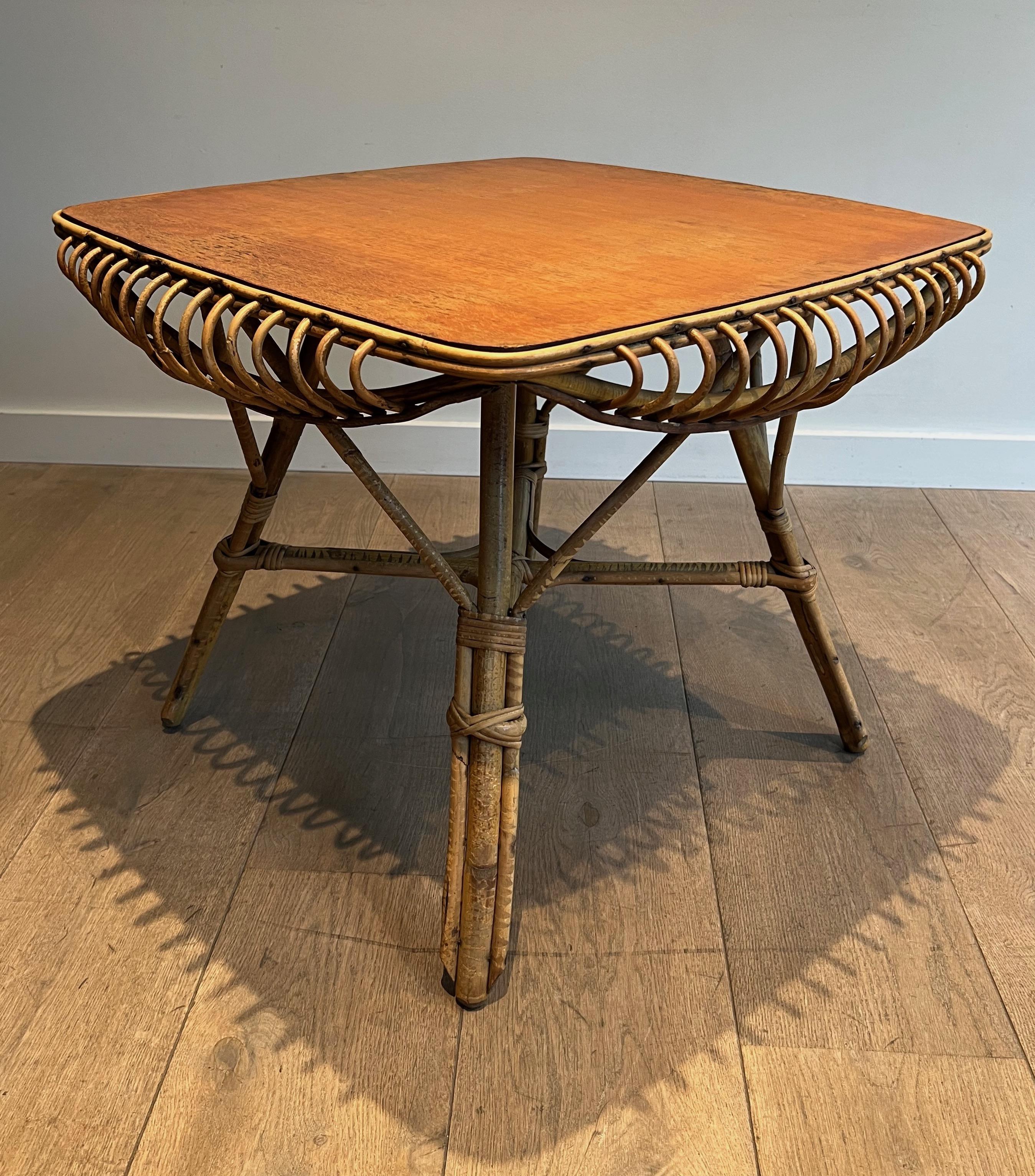 This unusual coffee table is all made of rattan. This is a French work. circa 1950.