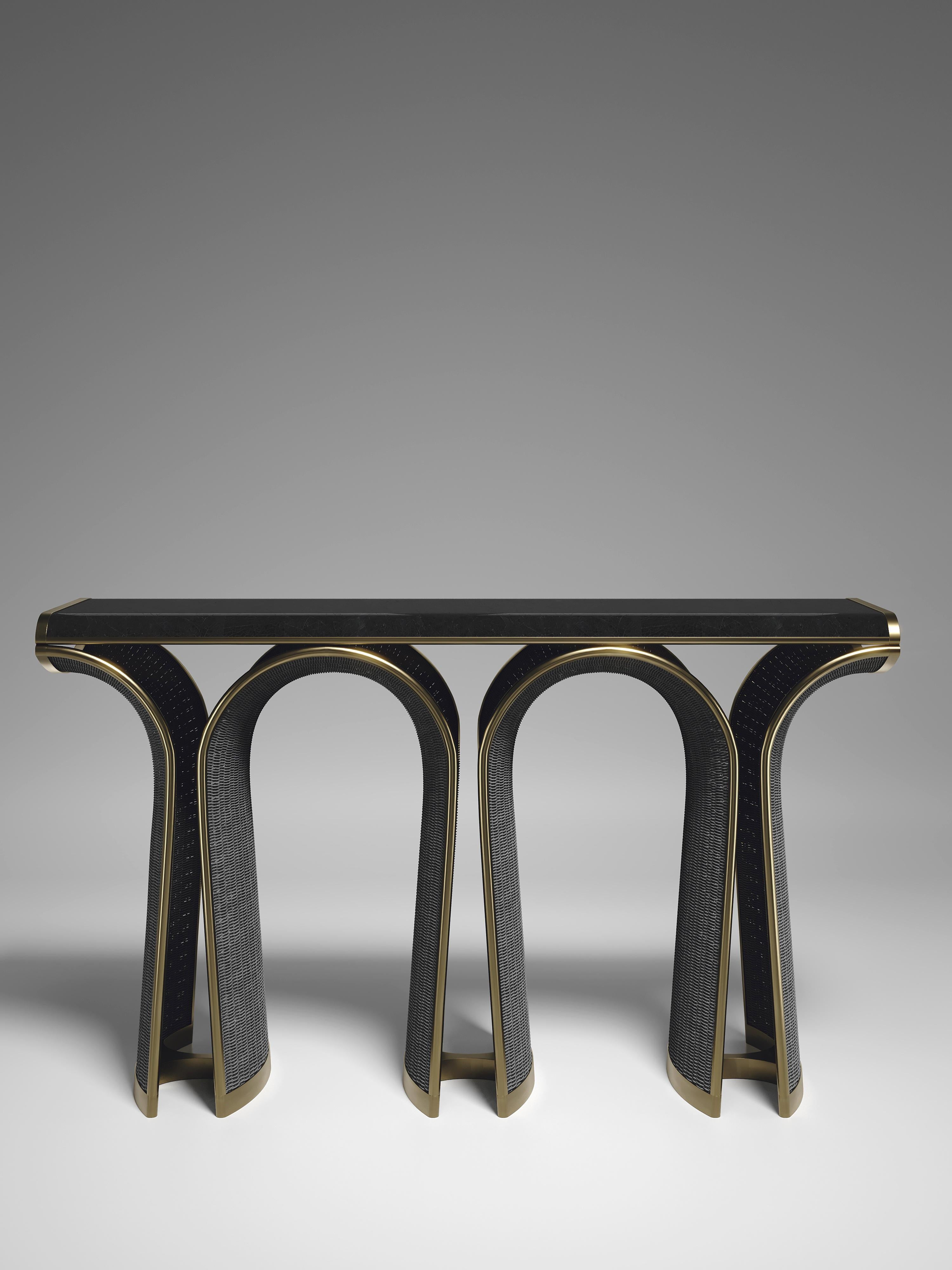 The Nymphea Console by R & Y Augousti is a part of their new Rattan capsule launch. The piece explores the brand's iconic DNA of bringing old world artisanal craft into a contemporary and utterly luxury feel. This table is done in a black rattan
