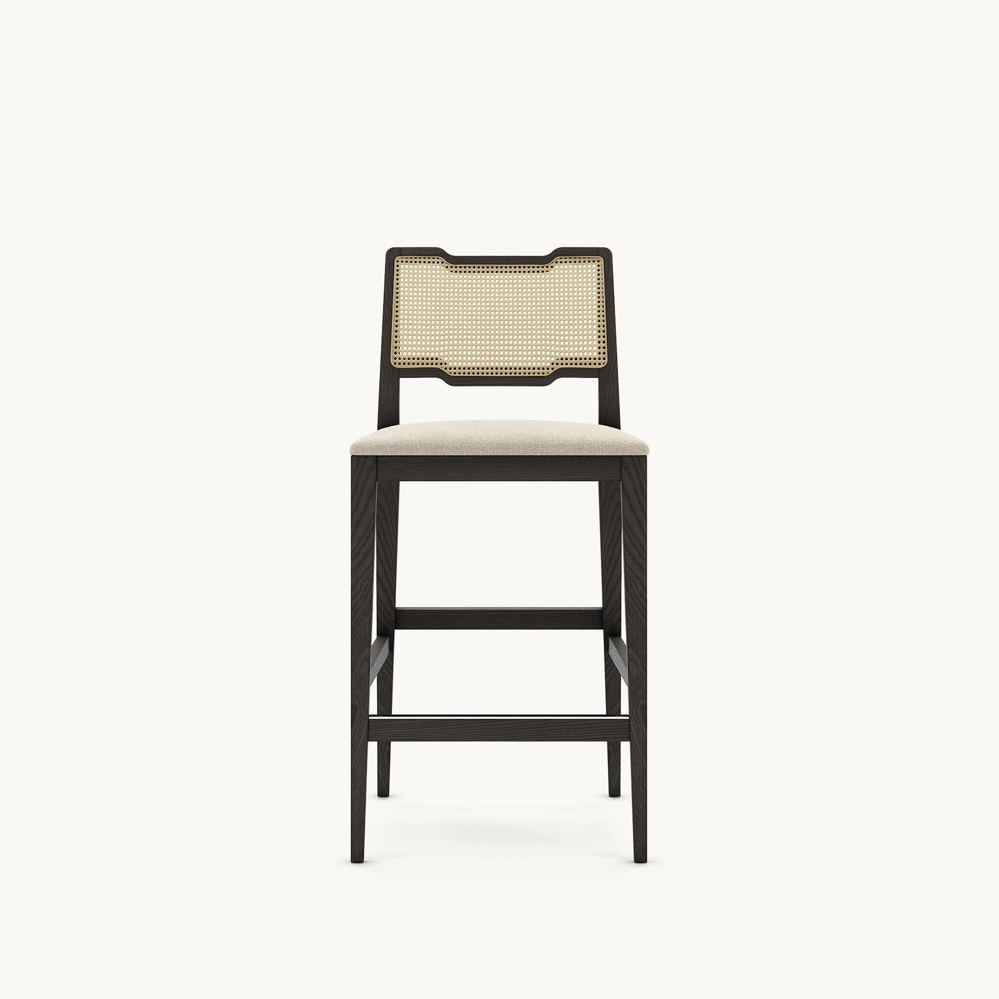Made to last, the solid wood structure of this counter stool combines the perfect mix of a contemporary design with vintage twist. The detailed woven-work technique on the back promises to make a statement in any room as distinguished as it is. The