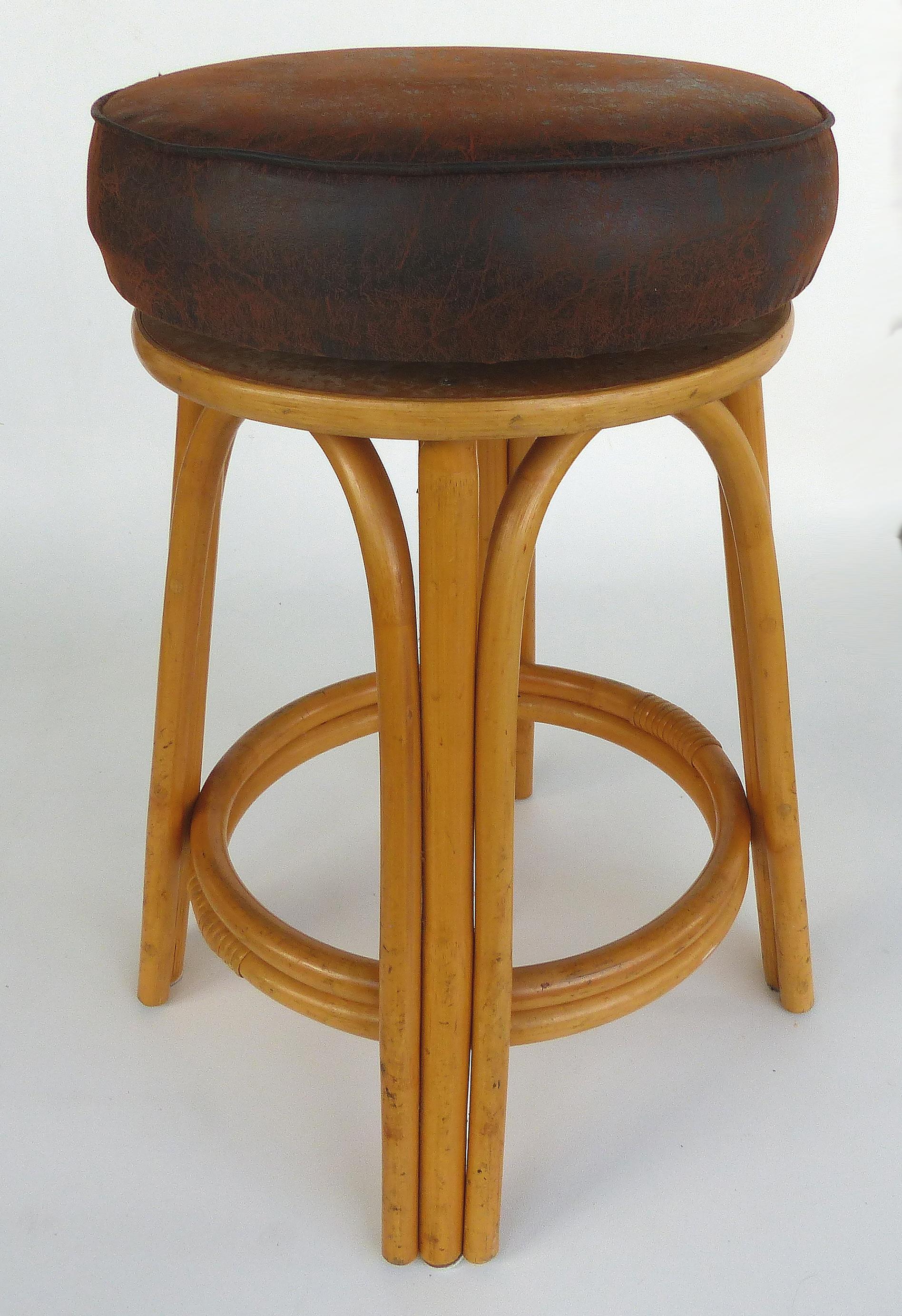 Clark Casual Furniture Rattan Counter Stools, Pair available

Offered for sale are three bent rattan counter stools manufactured by the Clark Casual furniture company of Kentucky. The seats are upholstered in an intentionally distressed look