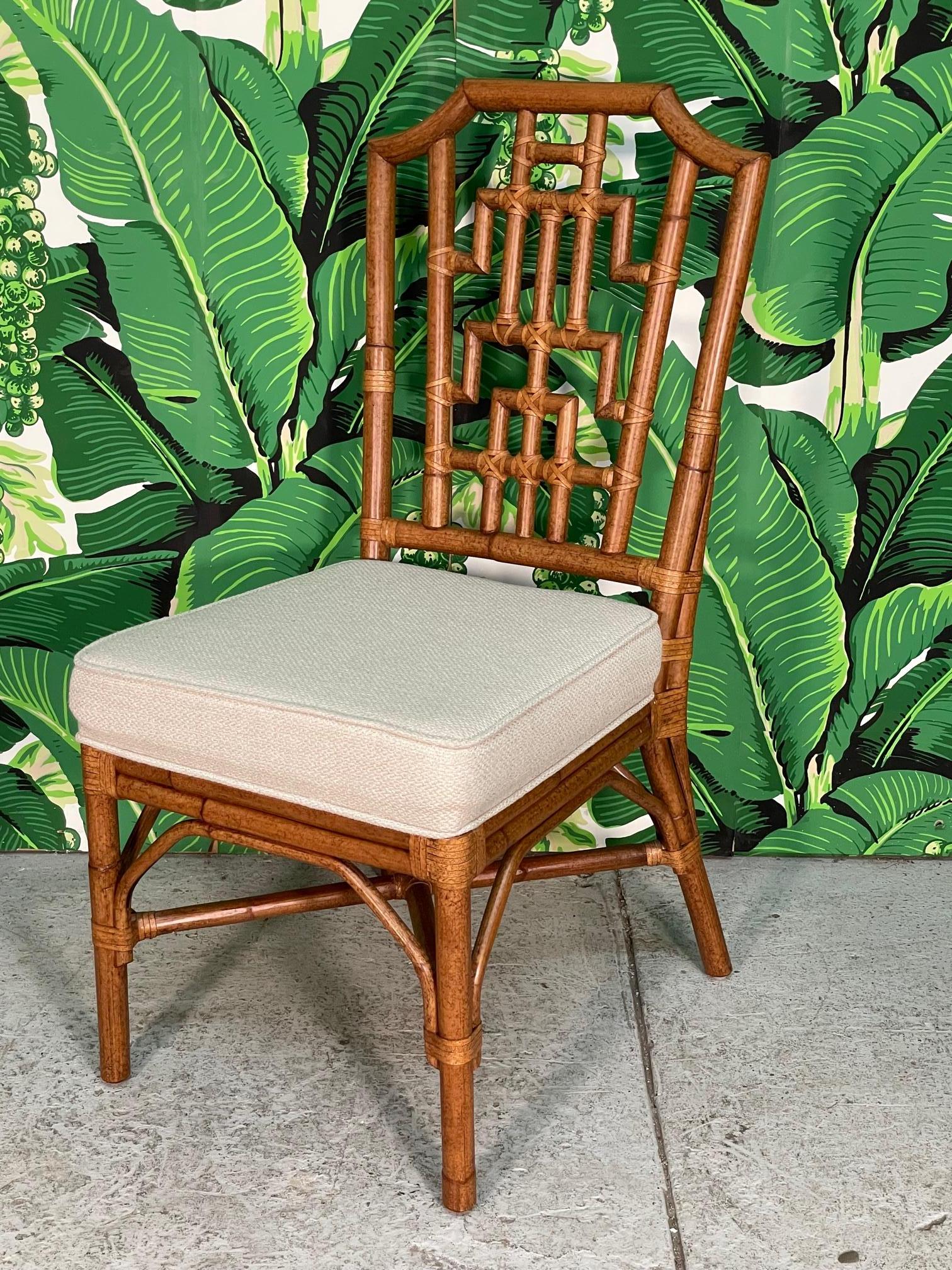 Set of six vintage rattan dining chairs feature a modern take on the Chinese Chippendale or pagoda style fretwork. Perfect compliment to any chinoiserie decor. Very good condition with only minor imperfections consistent with age (see photos).

 