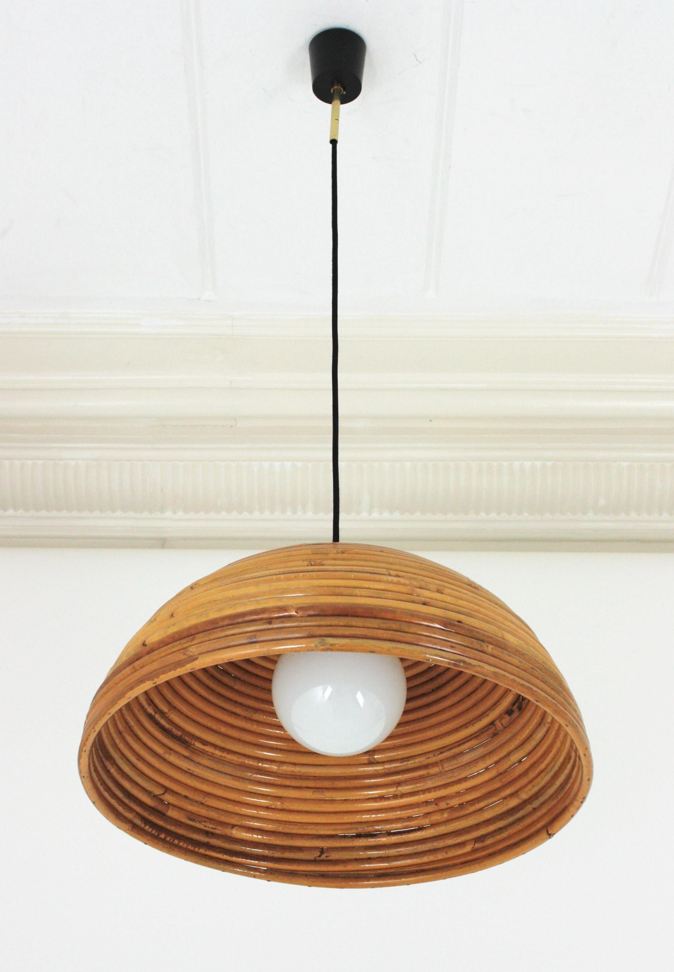 Fungo shaped rattan pencil reed pendant or suspension light, Italy, 1960s.
The design of this pendant is reminiscent of the Fungo model from the Rising Sun collection by Italian designer Gabriella Crespi.
The dome shade is suspended on a black
