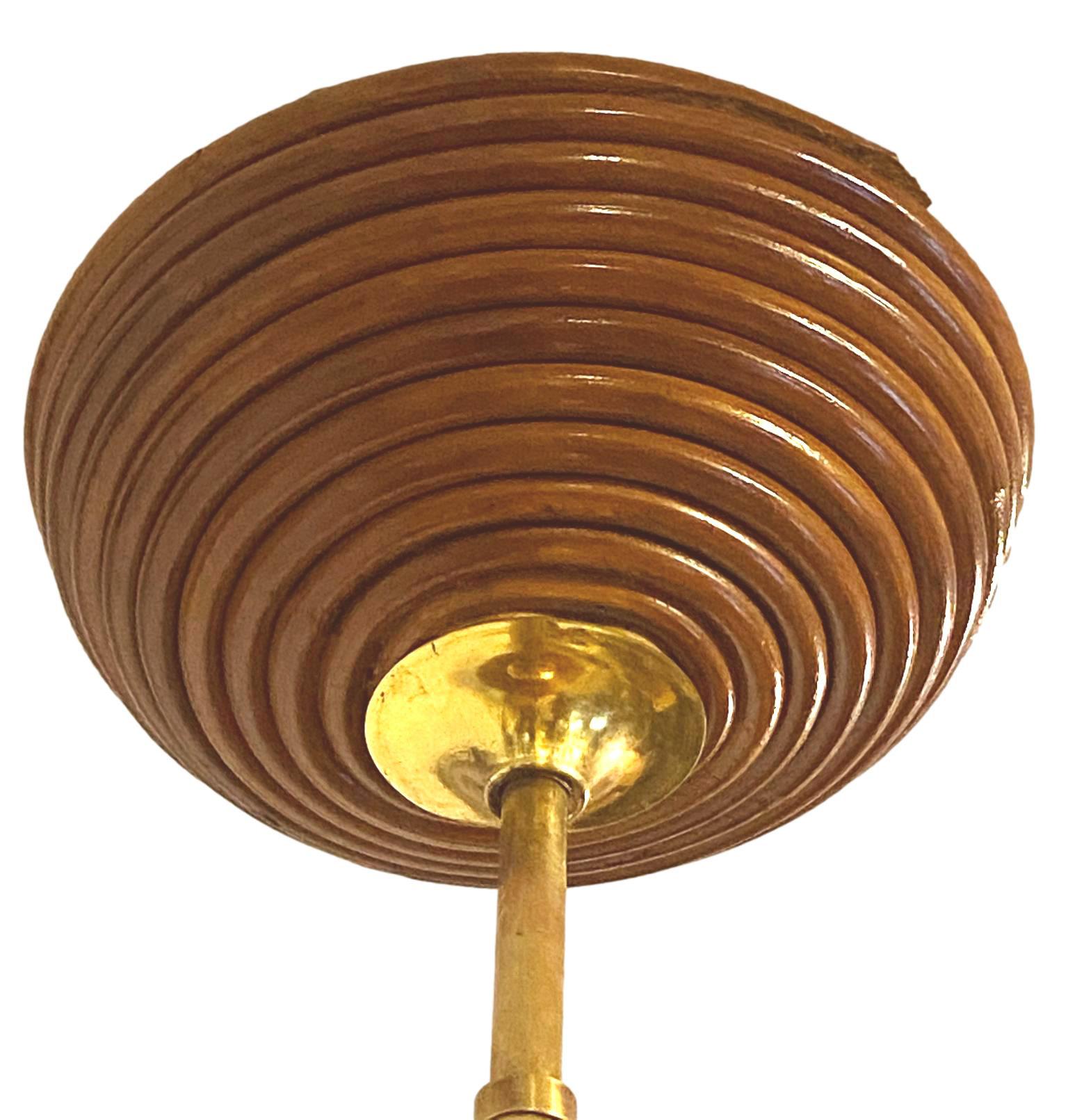 Mushroom-shaped pendant lamp in rattan, pencil barrel and brass, Italy, 1960s. The domed lampshade is suspended on a rattan chain topped with brass inserts. Excellent condition.