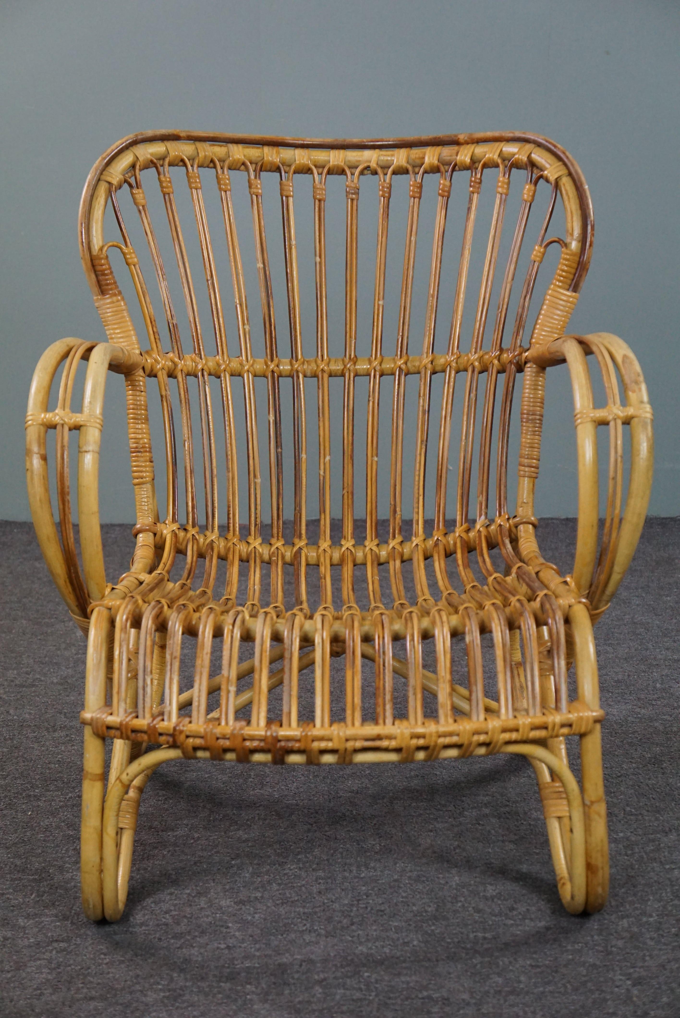 Offered is this unique and very beautifully designed Dutch Design armchair made in the 1950s in the Netherlands.

This rattan Belse 8 armchair, which is in very good condition, has a timeless design, a beautifully shaped and ergonomic back and