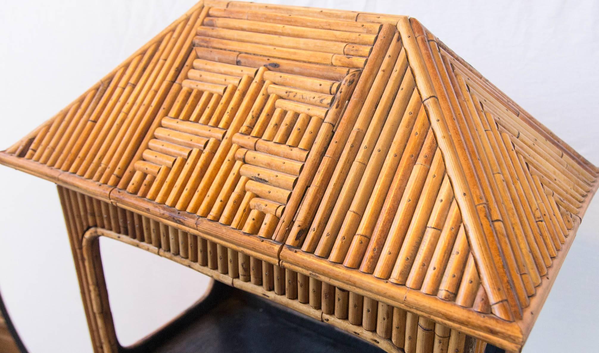 Rattan étagère or dry bar with drawer. Body is 25 wide, 15.5 deep. It is in three pieces. A unique piece with nicely detailed bamboo work. Use your imagination!
