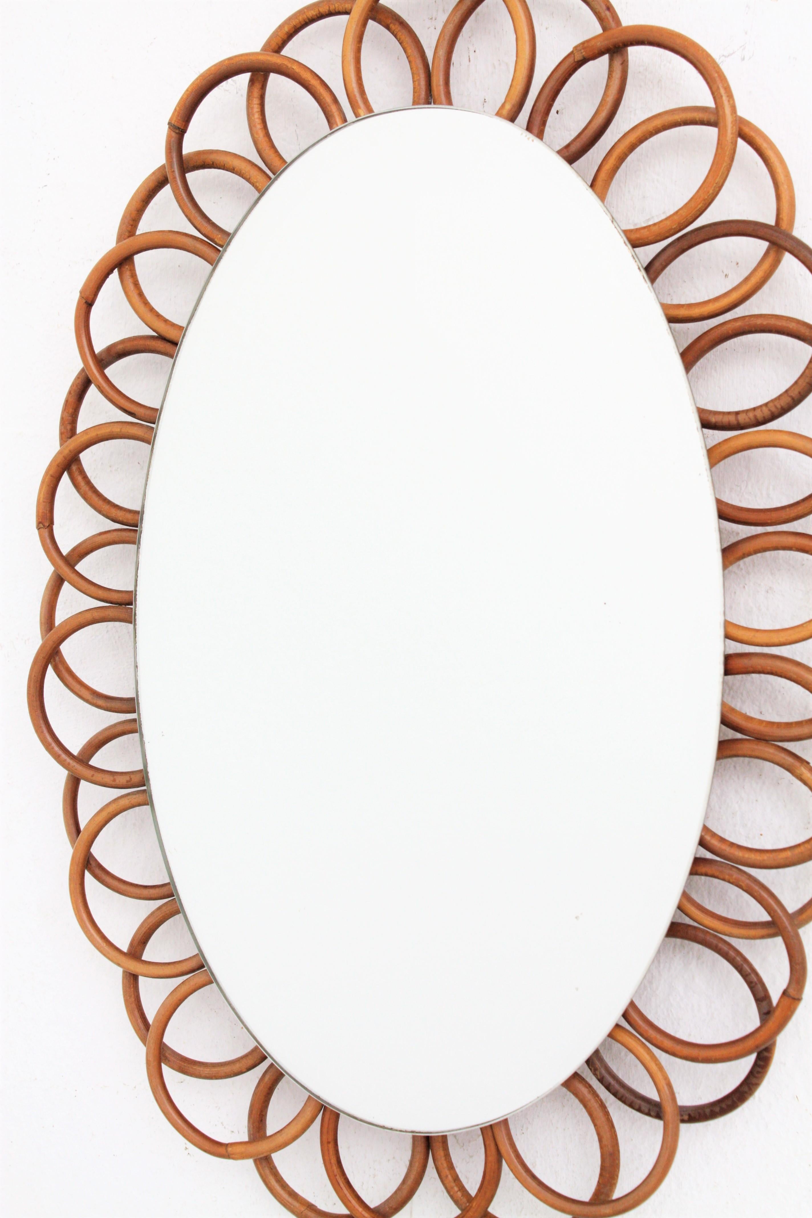 Mid-Century Modern French Rattan Oval Shaped Hanging Mirror For Sale