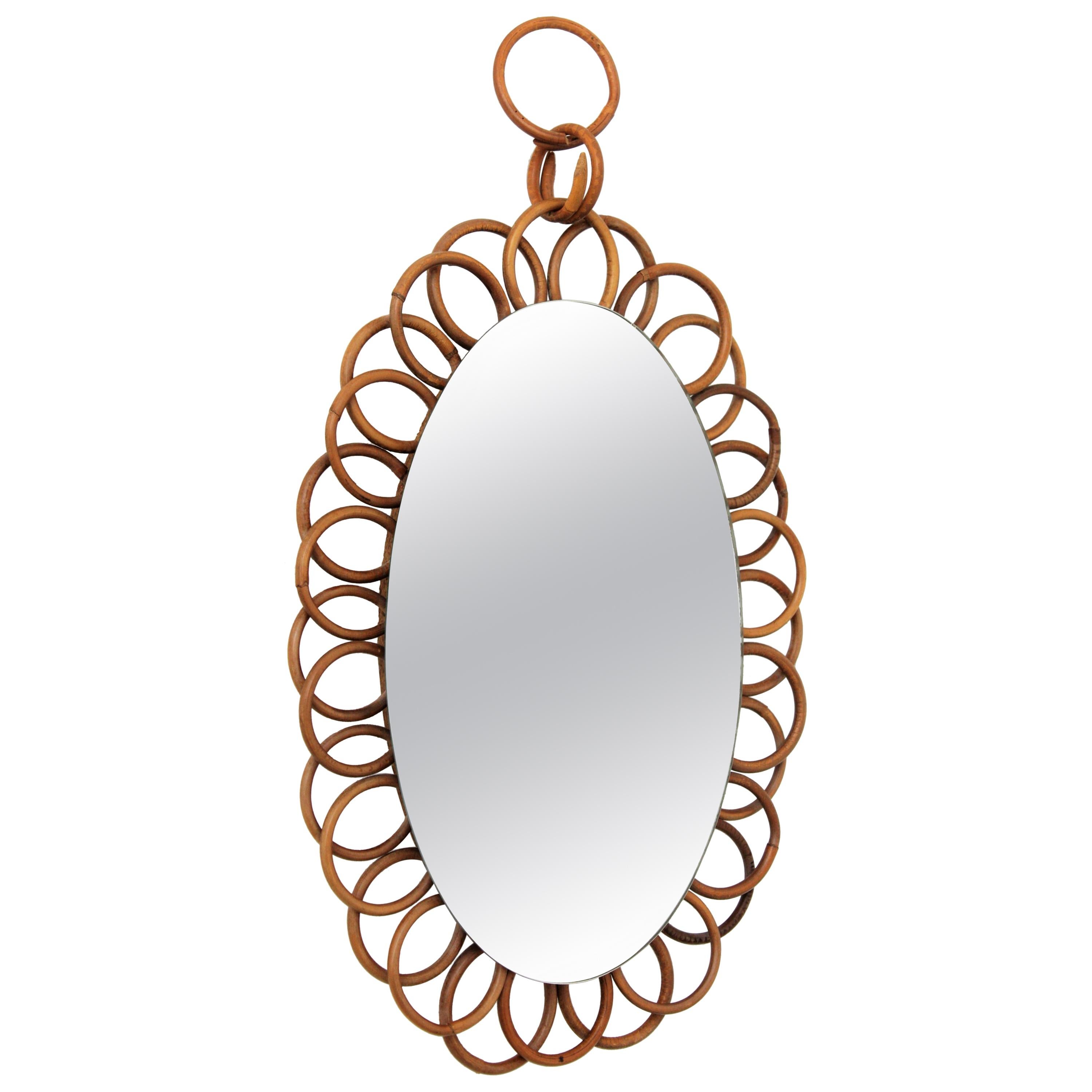 French Riviera rattan flower sunburst hanging wall oval mirror
A lovely handcrafted rattan flower shaped rattan oval mirror hanging from a rattan chain. This piece has all the taste of the Mid-Century Modern Mediterranean taste, France,