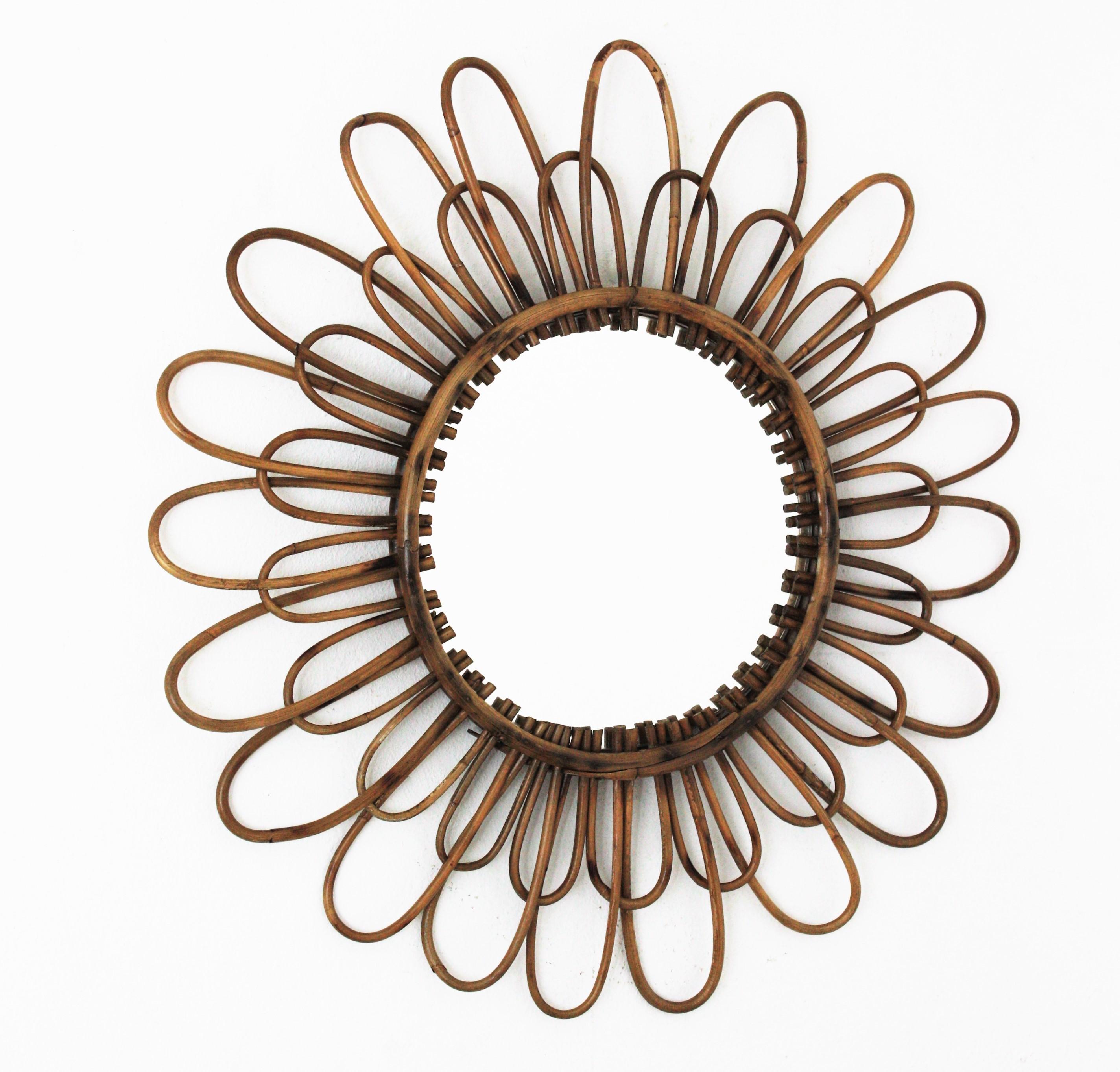 French 1960s handcrafted rattan double layered flower shaped mirror
A lovely Mediterranean style handcrafted rattan flower shaped mirror with two layers of petals in two sizes and pyrography accents.
Beautiful to place alone and interesting as a