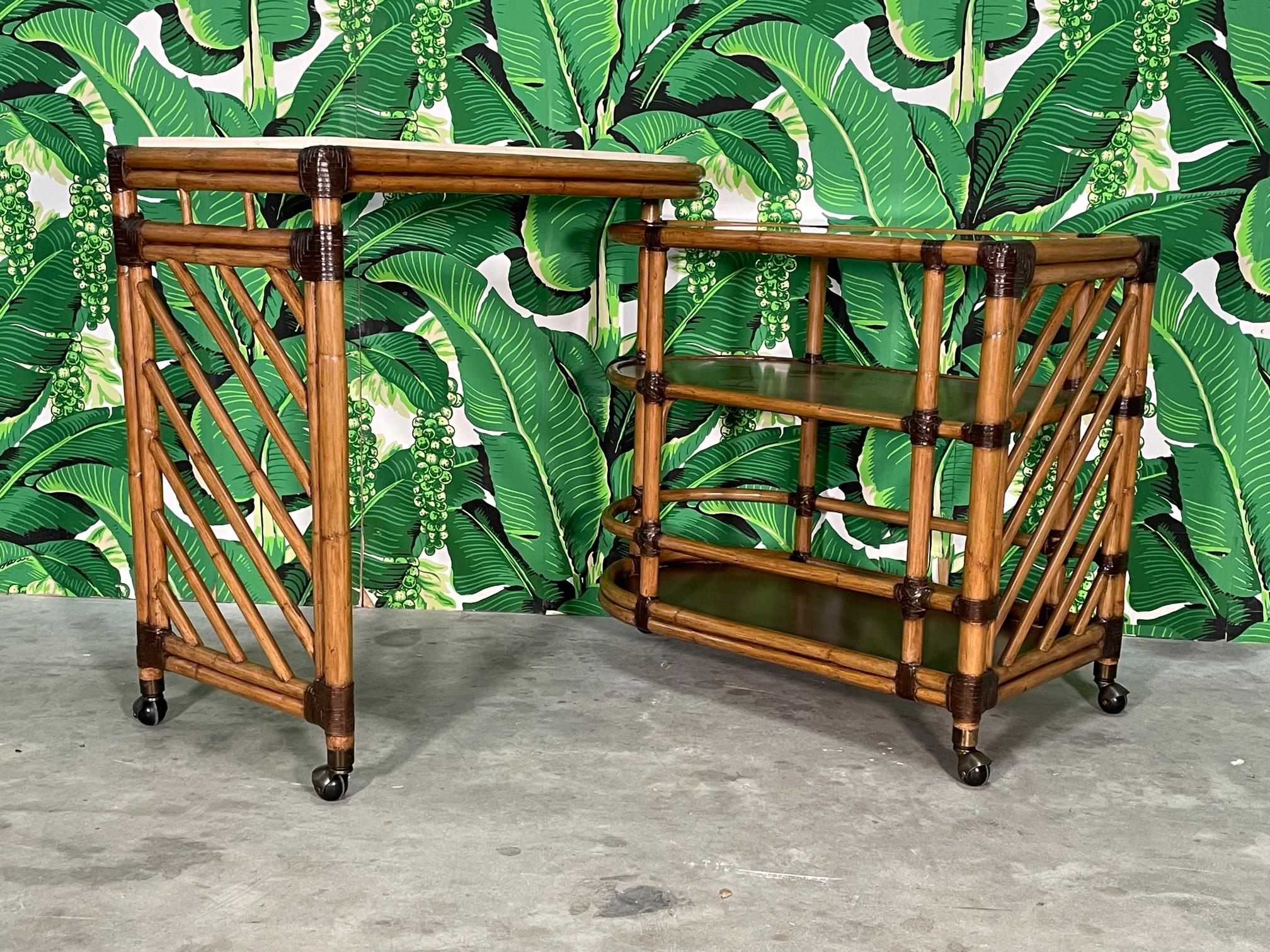Rattan bar cart by Lexington Furniture features folding design and antique brass casters. Beveled glass top on lower section, upper section has a sealed Cordova stone surface. Good condition with minor imperfections consistent with age, see photos