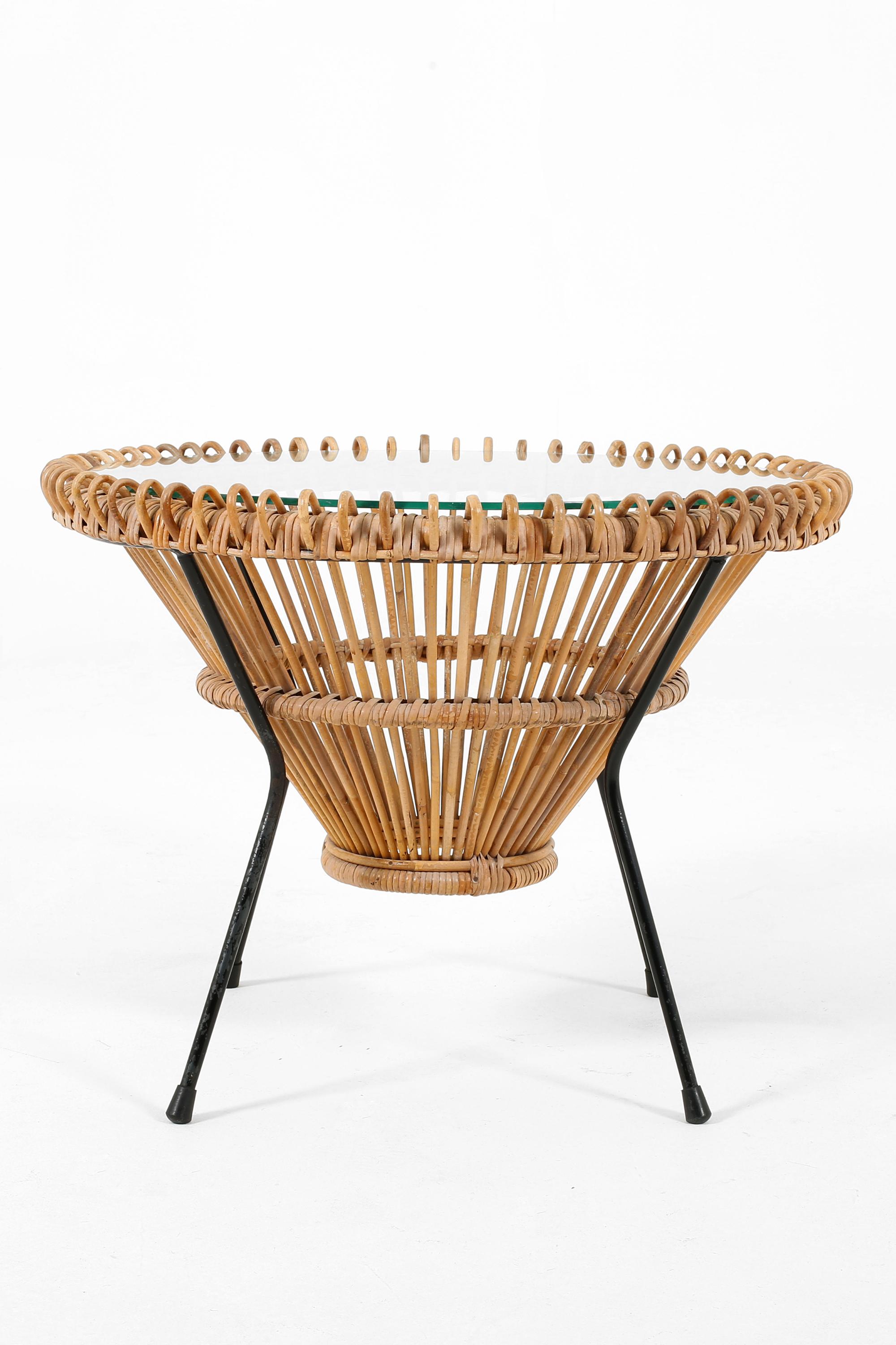 A rattan, glass and black enamelled steel circular occasional table by Franco Albini. Italian, c. 1950s.