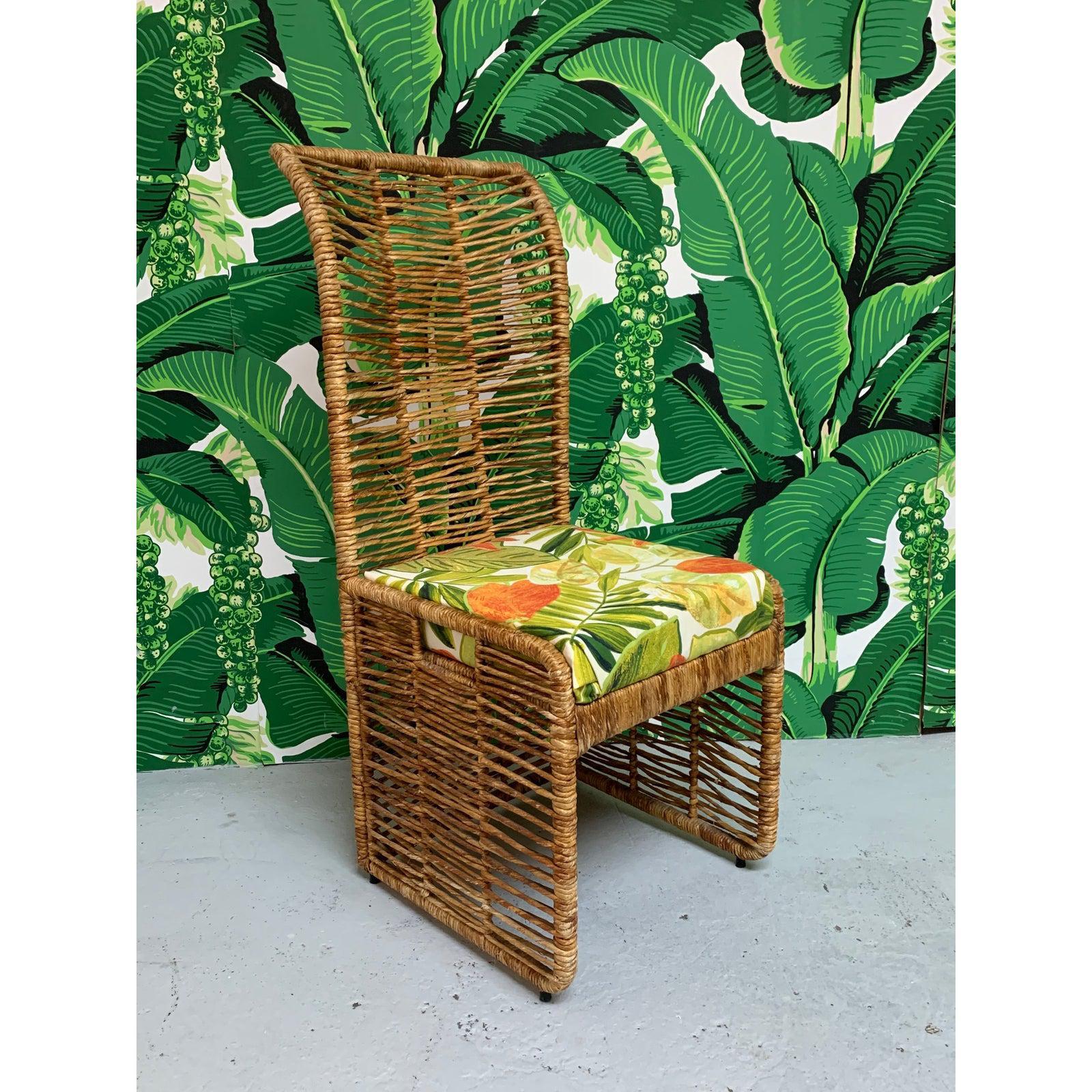Unique tiki style dining set consists of 6 rattan rope wrapped dining chairs upholstered in a tropical palm leaf print and matching pedestal table with glass top. Steel frame construction, heavy and sturdy. Two arm chairs and four side chairs. Very
