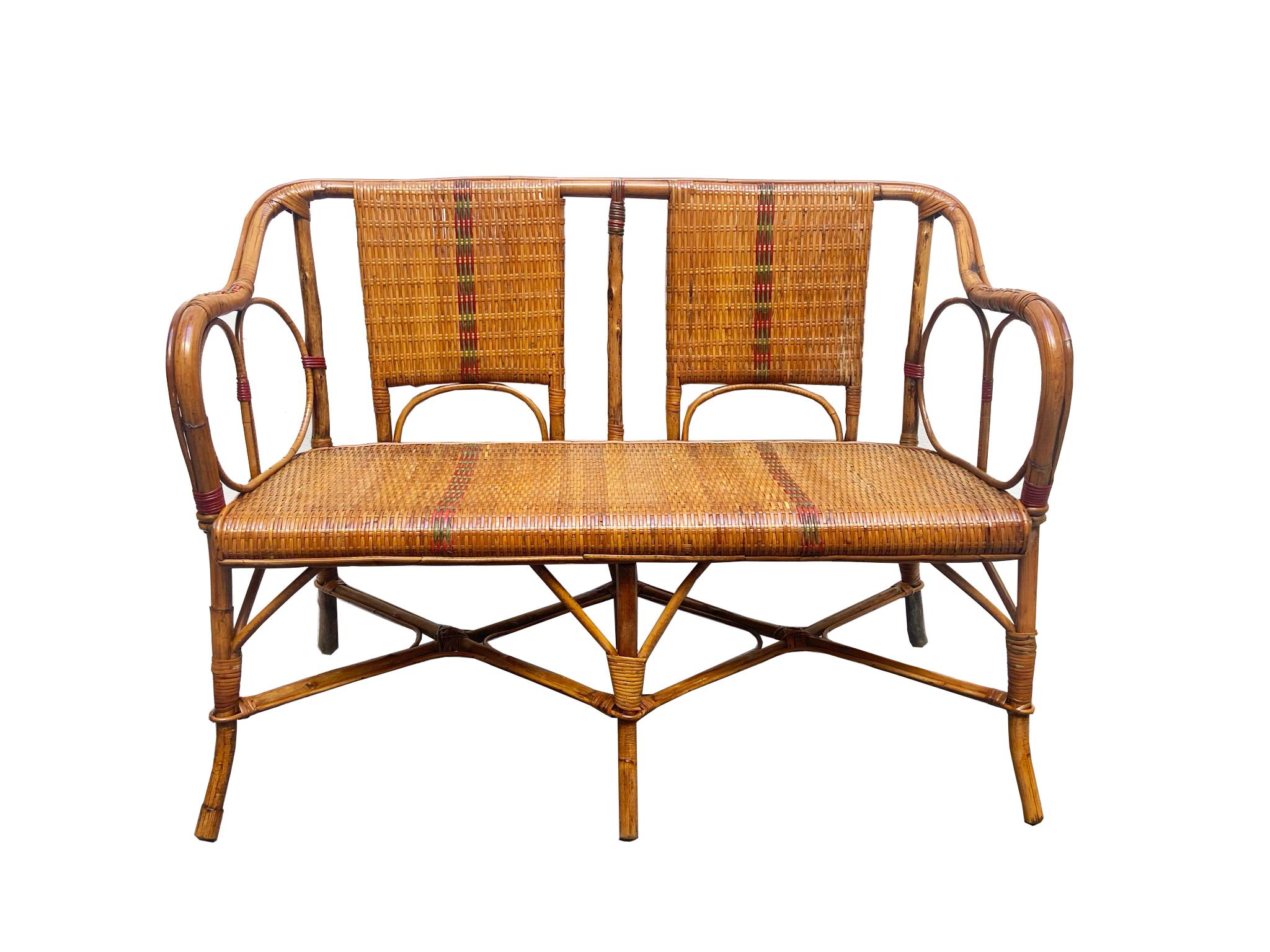 Beautiful set for living room or garden in rattan with colored profiles, Art Deco style of the 50s. The structure is in light brown natural wicker fiber, and inserts in colored plastic. The set consists of a sofa, two armchairs and a delightful