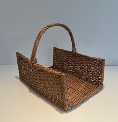 Rattan logs holder. French work. Circa 1970