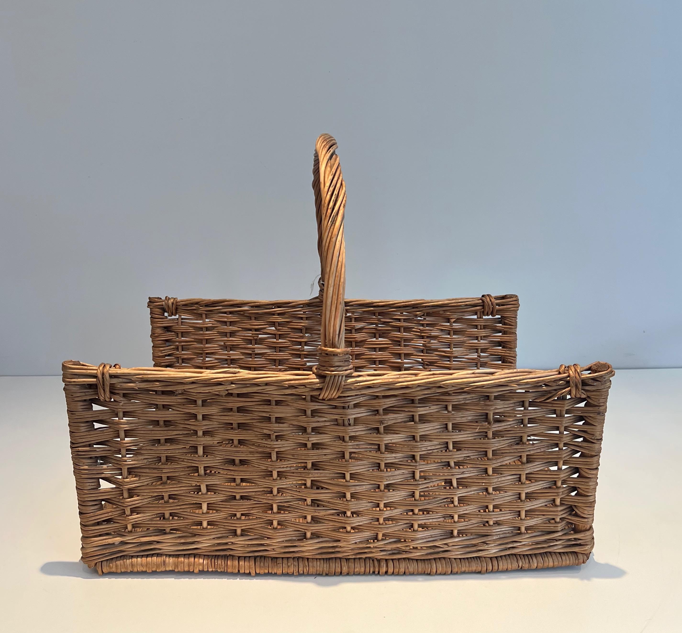 Late 20th Century Rattan logs holder. French work. Circa 1970 For Sale
