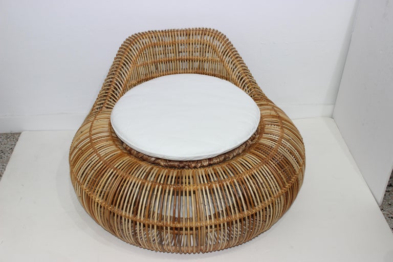 This stylish and chic rattan chair was acquired from a Palm Beach estate. 

Note: The canvas cushion measures 21