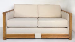 Rattan Loveseat Newly Upholstered in Ivory Canvas Cushions