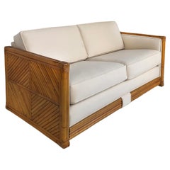 Rattan Loveseat Newly Upholstered in Ivory Canvas Cushions