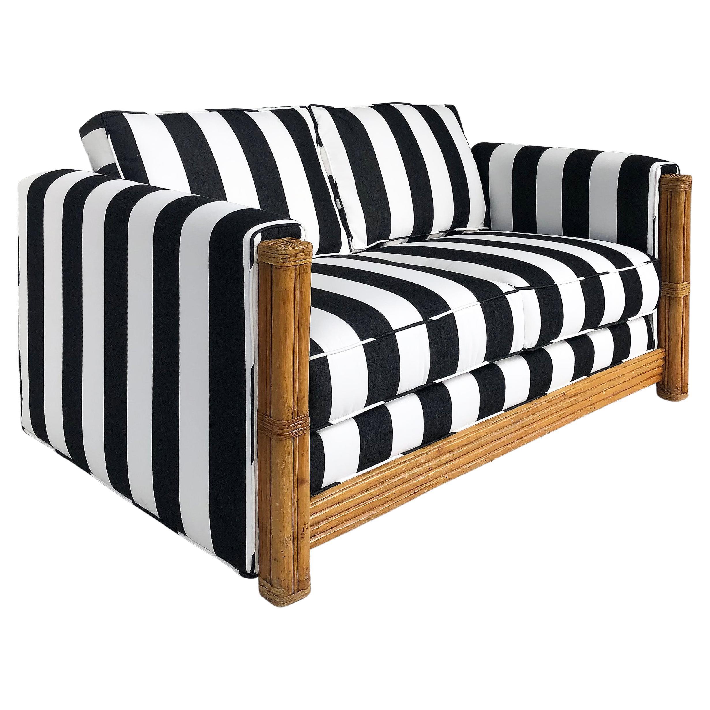 Rattan Loveseat Newly Upholstered with Black & White Striped Fabric For Sale