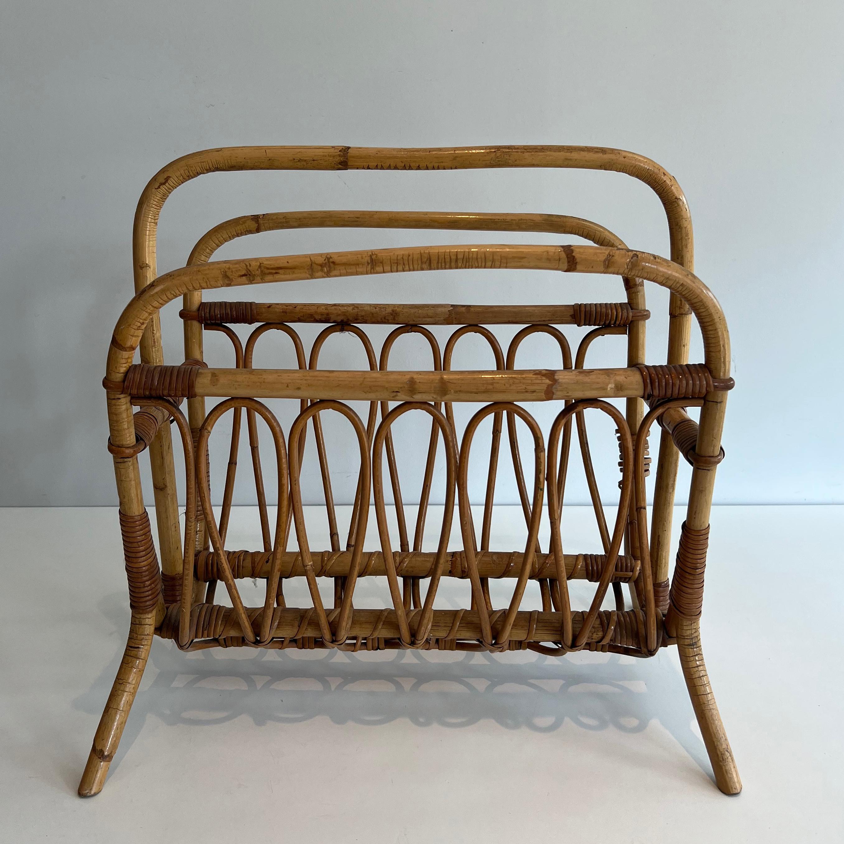 This nice magazine rack is made of rattan. this is a French work. Circa 1950