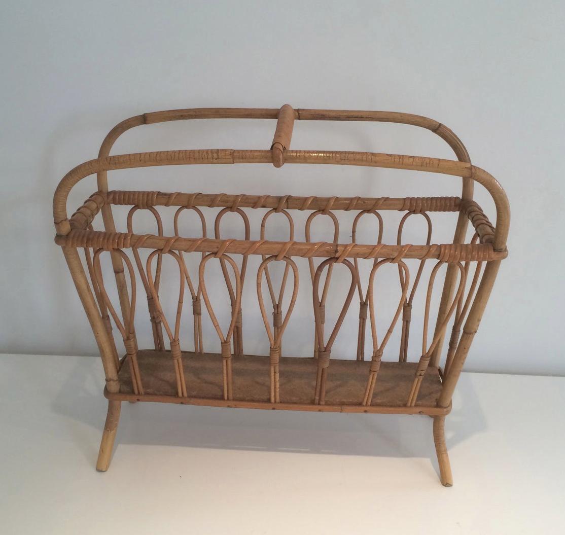 This magazine rack is made of rattan. This is a French work. Circa 1970.