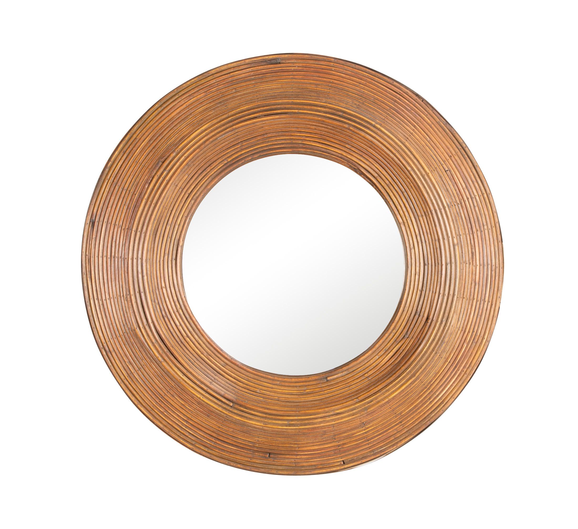 A round rattan mirror in the manner of Consuelo Crespi,

 1960s-1970s.