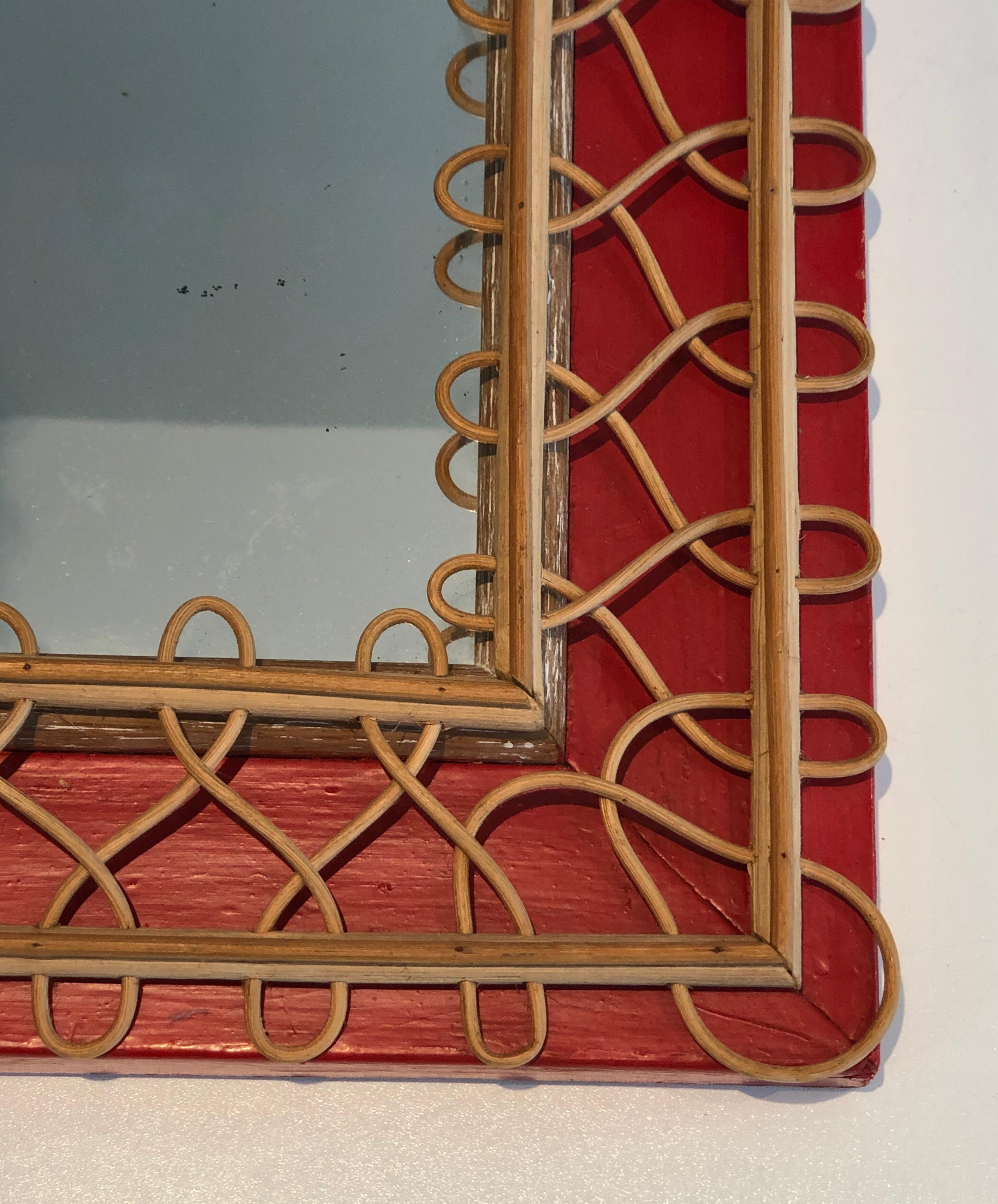 Rotin Miroir en rotin sur fond rouge. Travail français. Circa 1940 en vente