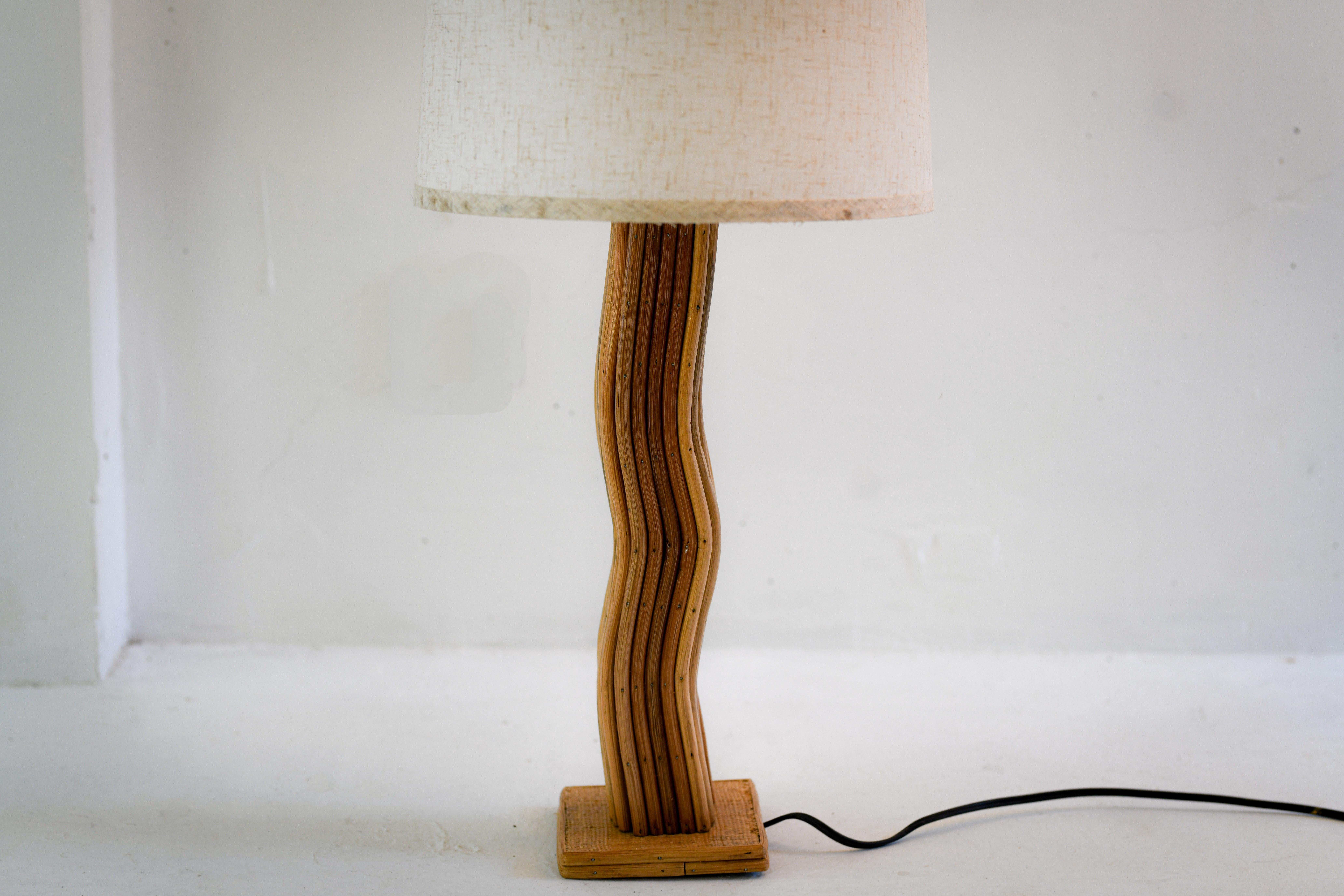 *Rattan Modern Wave Lamp
This elegant lamp features a wave-shaped design crafted from natural rattan and abaca, embodying the organic aesthetic of mid-century modern design.
Its unique form casts intriguing shadows, creating a warm and inviting