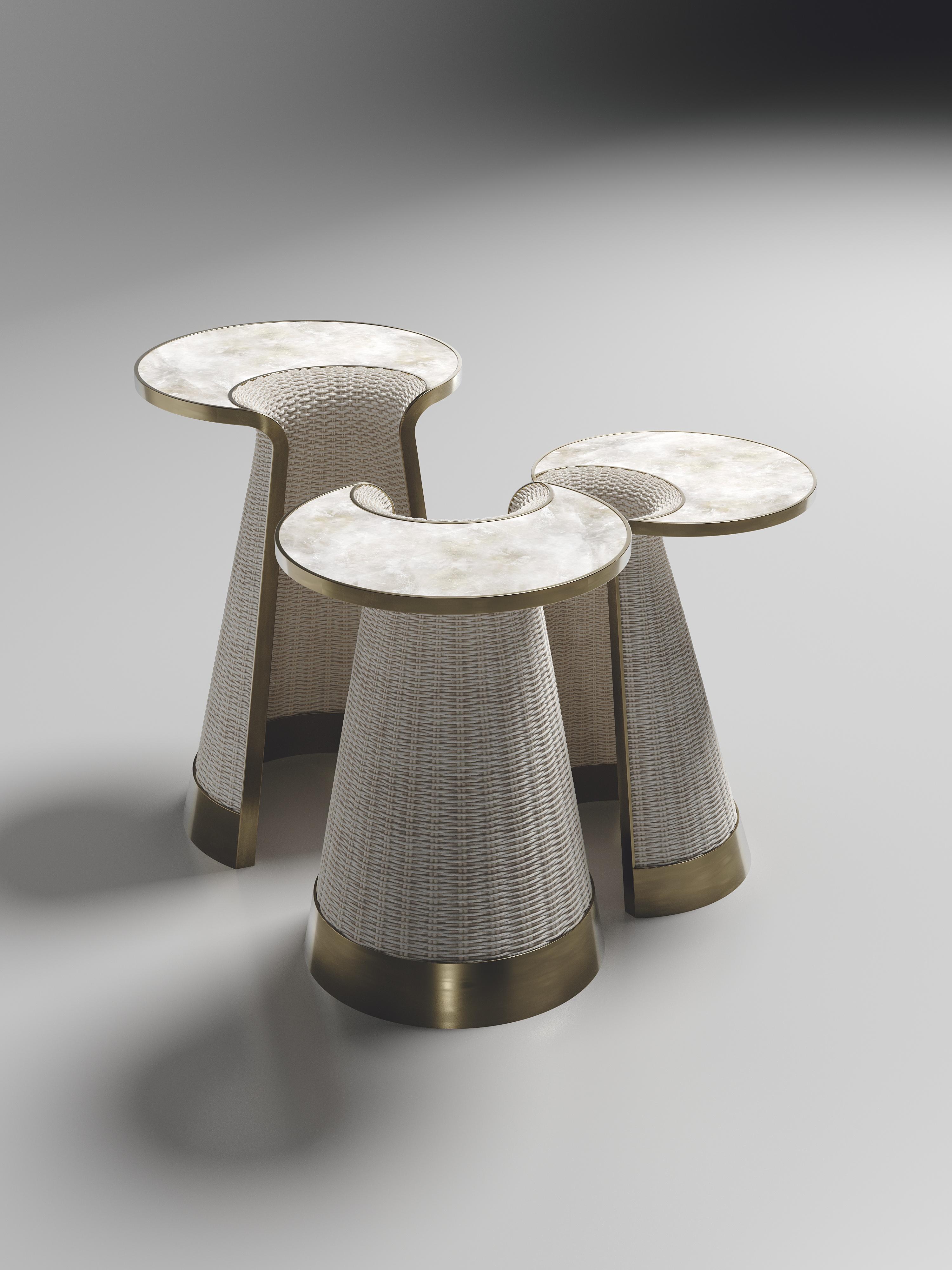 The Nymphea Set of 3 Nesting Side tables by R & Y Augousti are a part of their  new Rattan capsule launch. The pieces explore the brand's iconic DNA of bringing old world artisanal craft into a contemporary and utterly luxury feel. This set is done