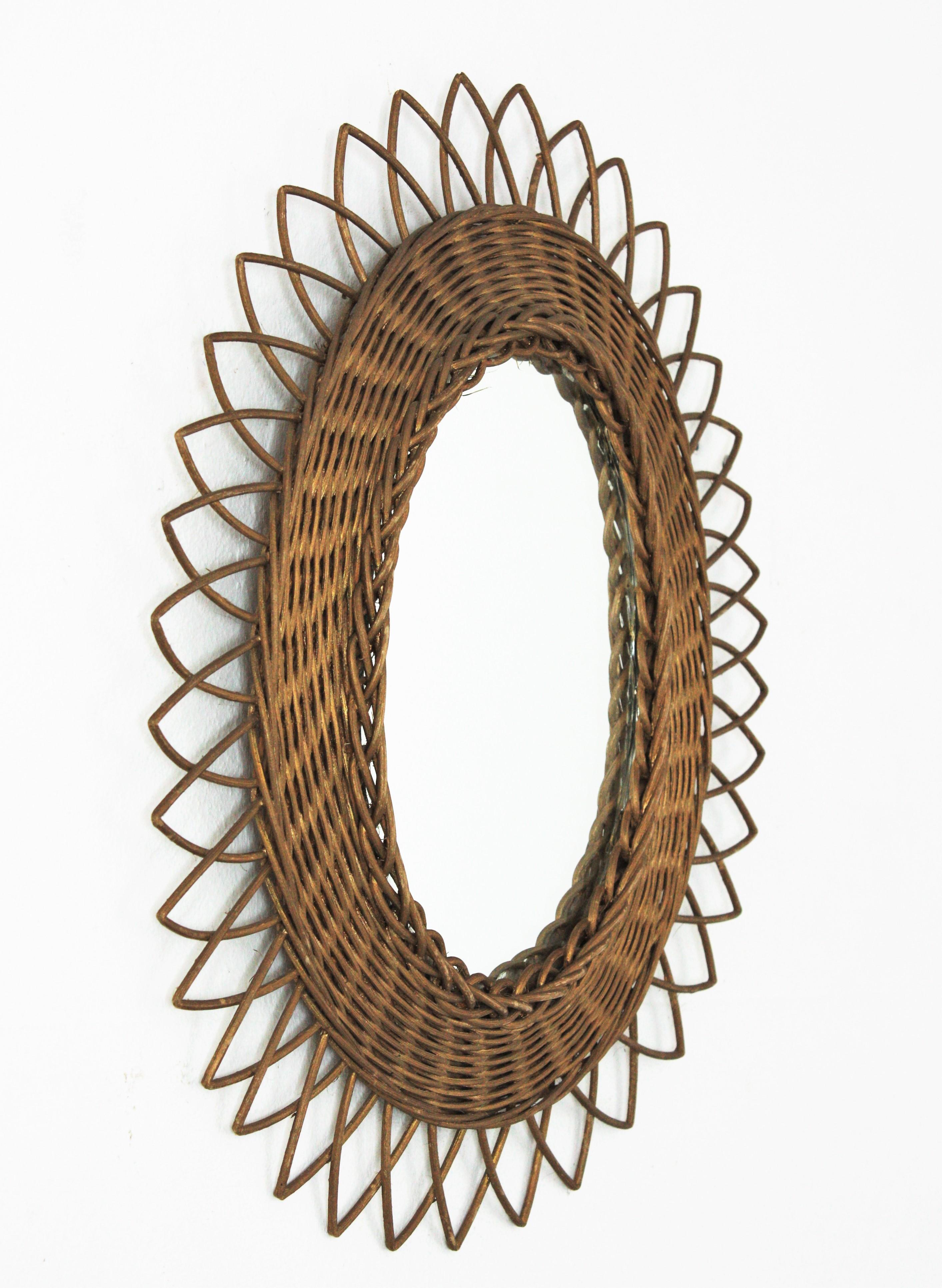 Mid-Century Modern Rattan Oval Sunburst Mirror with Gold Paint For Sale