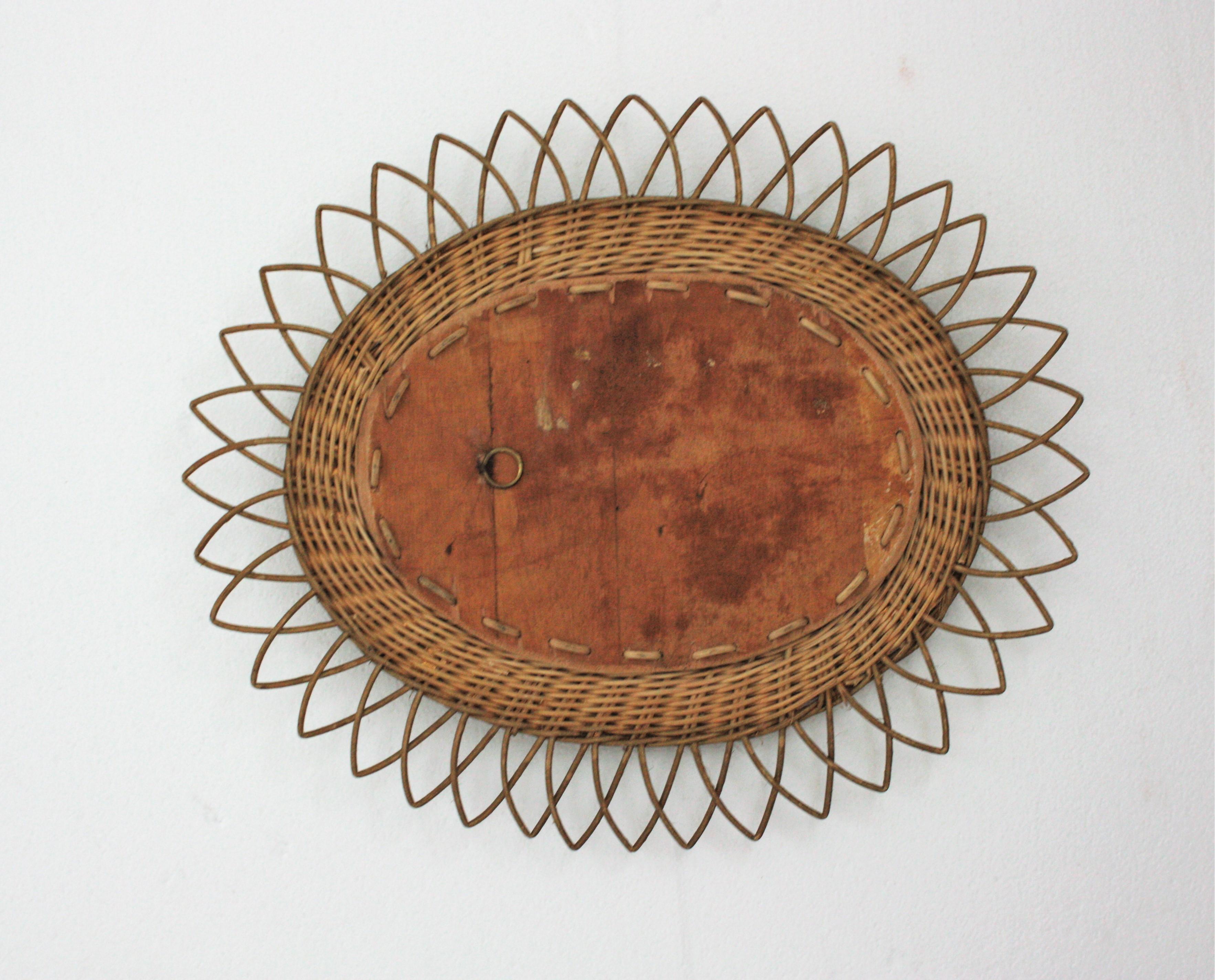 Rattan Oval Sunburst Mirror with Gold Paint In Good Condition For Sale In Barcelona, ES