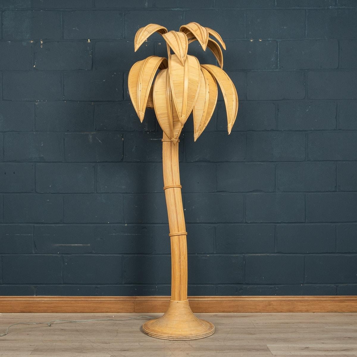 A wonderful mid 20th century palm tree floor lamp with woven coconut shades. This impressive floor light was designed by the Mexican artist Mario Lopez Torres who was well known for his sculptural wicker creations in the mid 1970s and sold by