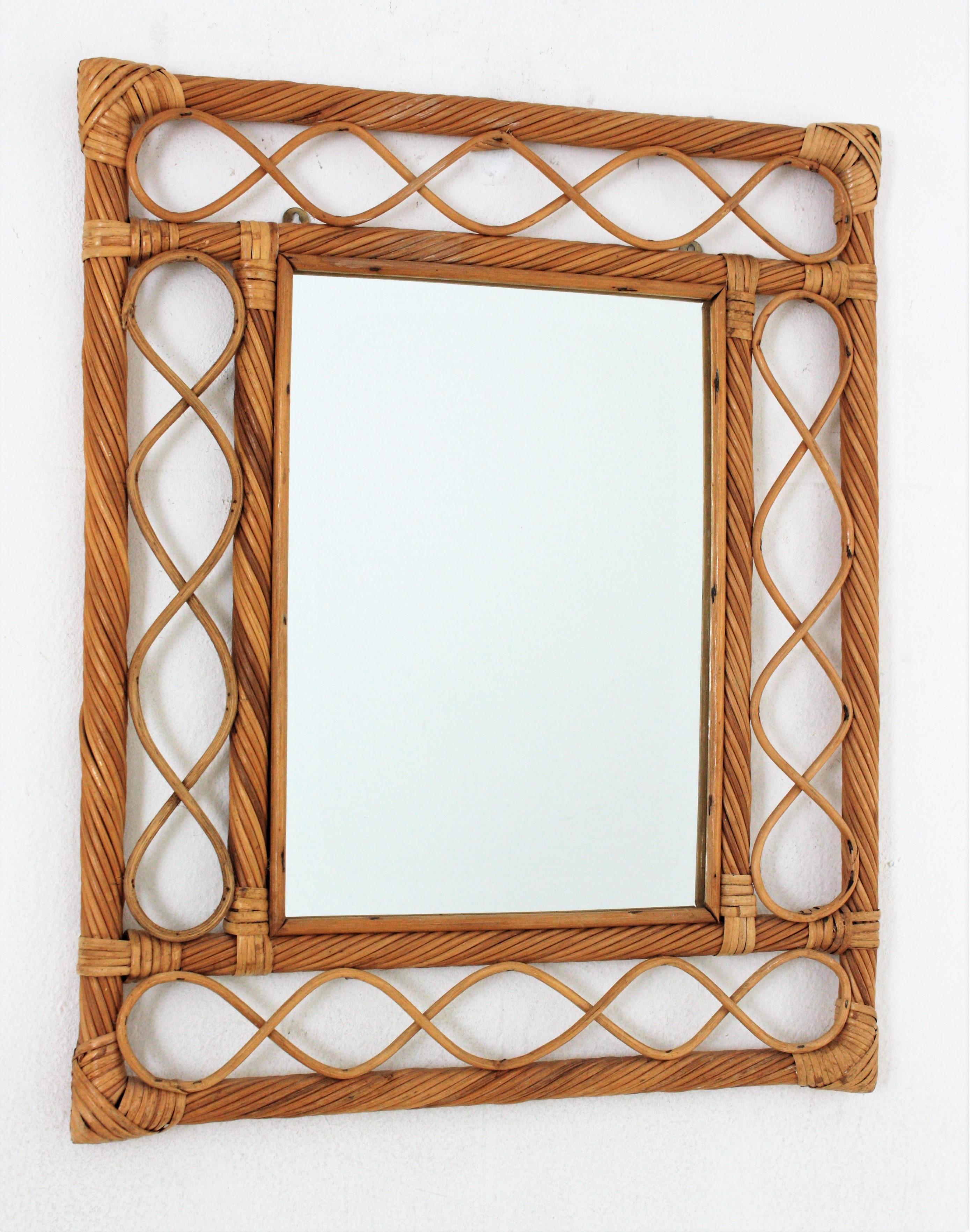 Eye-catching Mid-Century Modern Franco Albini style handcrafted attan mirror. Italy, 1960s.
This mirror features a rectangular frame made of pencil reed rattan canes and decorative rattan undulations.
This rattan mirror will be a nice addition