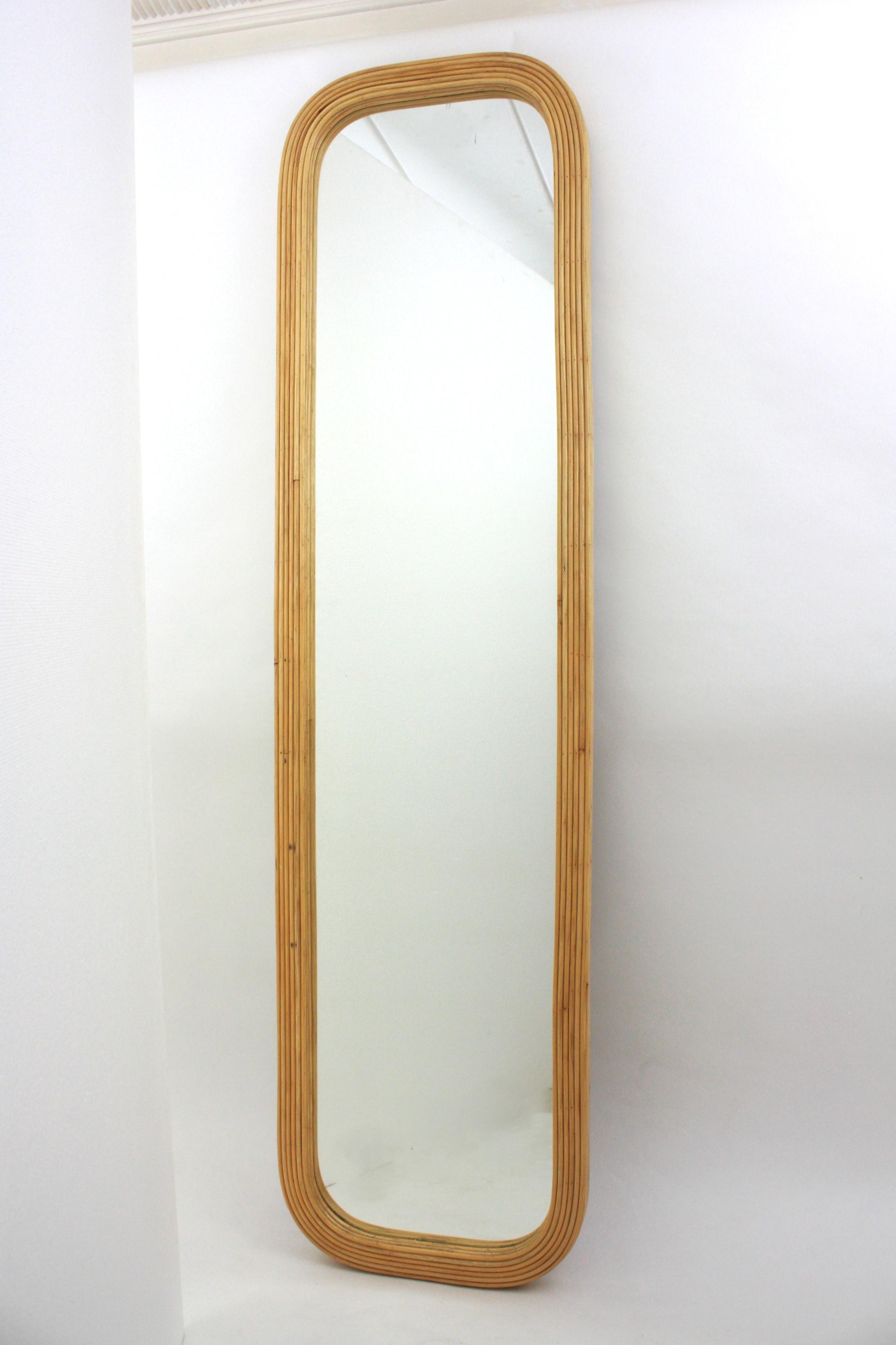 Rectangular wall mirror / floor mirror, Pencil Reed, Rattan, Italy, 1960s.
Eye-catching full length rattan mirror. The frame has a nice construction with 14 tiers of pencil reed rattan canes.
To be used as wall mirror in a bathroom or any other room