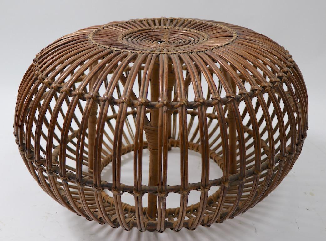 Nice example of Classic Albini wicker ottoman. The stool is in very good original condition showing only light cosmetic wear, specifically missing a bit of rattan trim wrapping, inconsequential and normal and consistent with age (pictured in