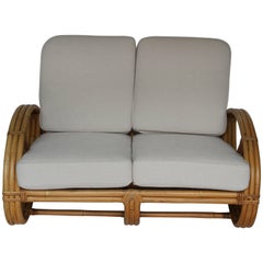 Rattan Pretzel Loveseat in the Style of Paul Frankl